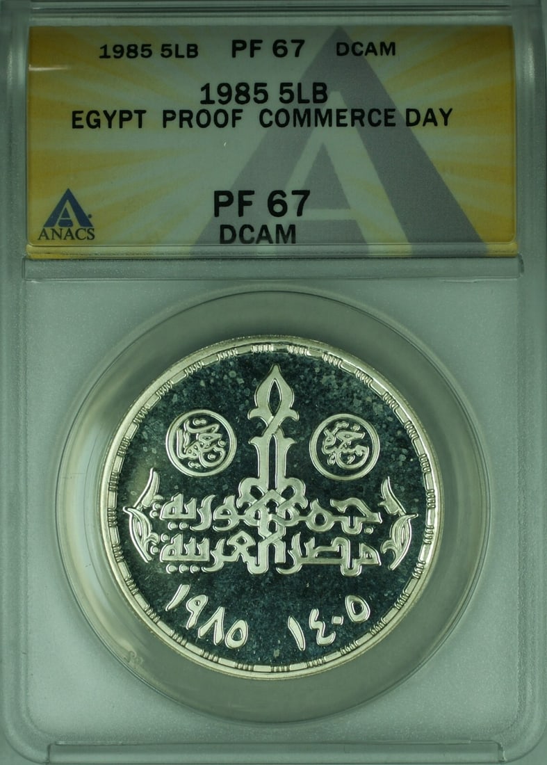 Egypt 1985 5 Pounds Silver Proof Coin Commerce Day ANACS PR67: Egypt 1985 5 Pounds Silver Proof Coin Commerce Day ANACS PR67 This 1985 Egypt 5 Pounds proof coin commemorates the 25th Anniversary of Traders/Commerce Day. Certified by ANACS with a grade of PF-67 DC