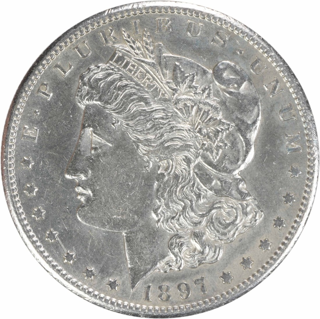 1897-S Morgan Silver Dollar AU Uncertified 90% Silver Coin: 1897-S Morgan Silver Dollar AU Uncertified 90% Silver Coin This 1897-S Morgan Silver Dollar is an intriguing piece of history, featuring a grade of AU (About Uncirculated). Struck in 90% silver and 10