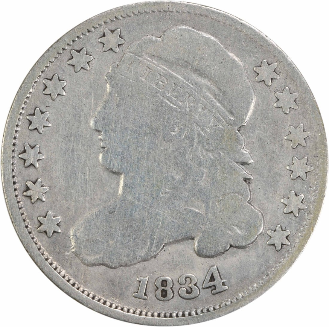 1834 Capped Bust Silver Dime 10C Philadelphia Uncertified: 1834 Capped Bust Silver Dime 10C Philadelphia Uncertified This 1834 Capped Bust Silver Dime, a notable piece from the Philadelphia Mint, features a design by John Reich. It is classified as Very Good 
