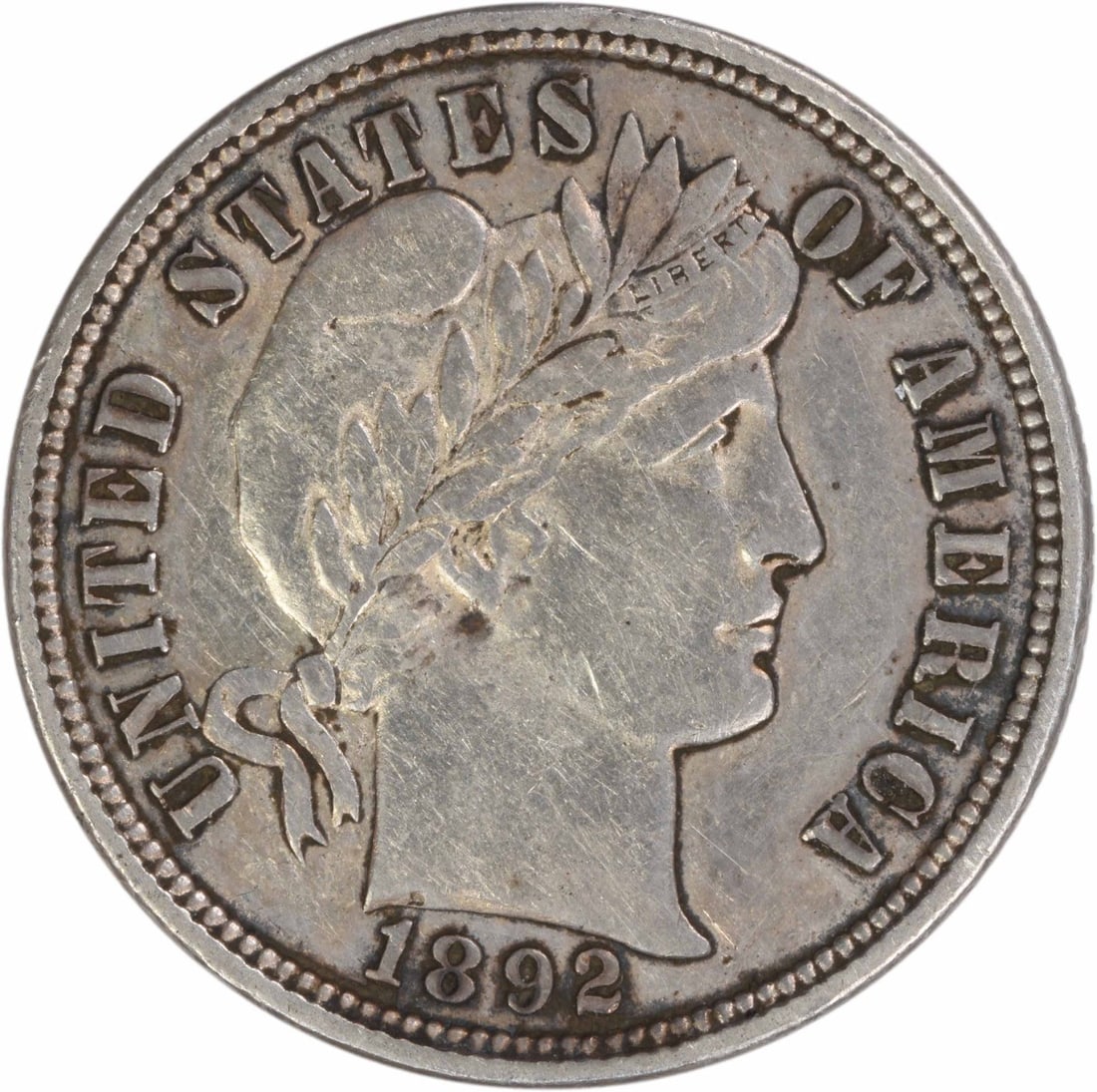 1892 AU Barber Dime Philadelphia Uncertified 90 Percent Silver: 1892 AU Barber Dime Philadelphia Uncertified 90 Percent Silver This 1892 Barber Silver Dime from the Philadelphia Mint is composed of 90% silver and 10% copper. Designed by Charles E. Barber, the coin