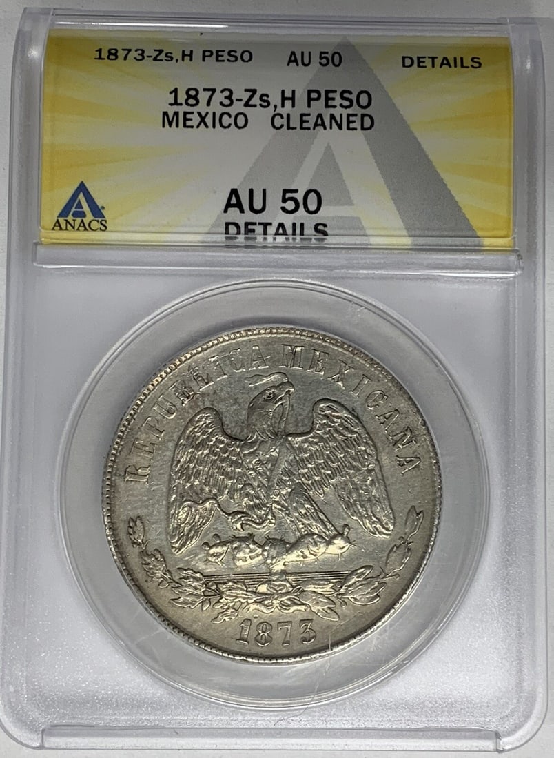 ANACS AU 50 1873 Mexico Peso Silver Coin Second Republic Cleaned: ANACS AU 50 1873 Mexico Peso Silver Coin Second Republic Cleaned This 1873-Zs,H Mexico Peso coin from the Second Republic period (1867-1905) is composed of silver and has been certified by ANACS with 