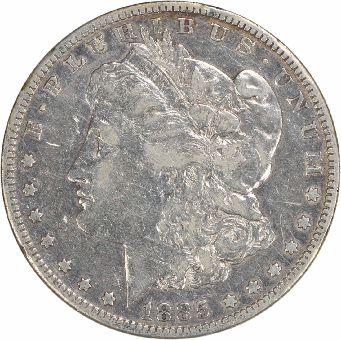 San Francisco 1885 Morgan Silver Dollar VF Grade Uncertified: San Francisco 1885 Morgan Silver Dollar VF Grade Uncertified This 1885-S Morgan Silver Dollar is a circulated coin from the United States, minted in San Francisco. Designed by George T. Morgan, it fea