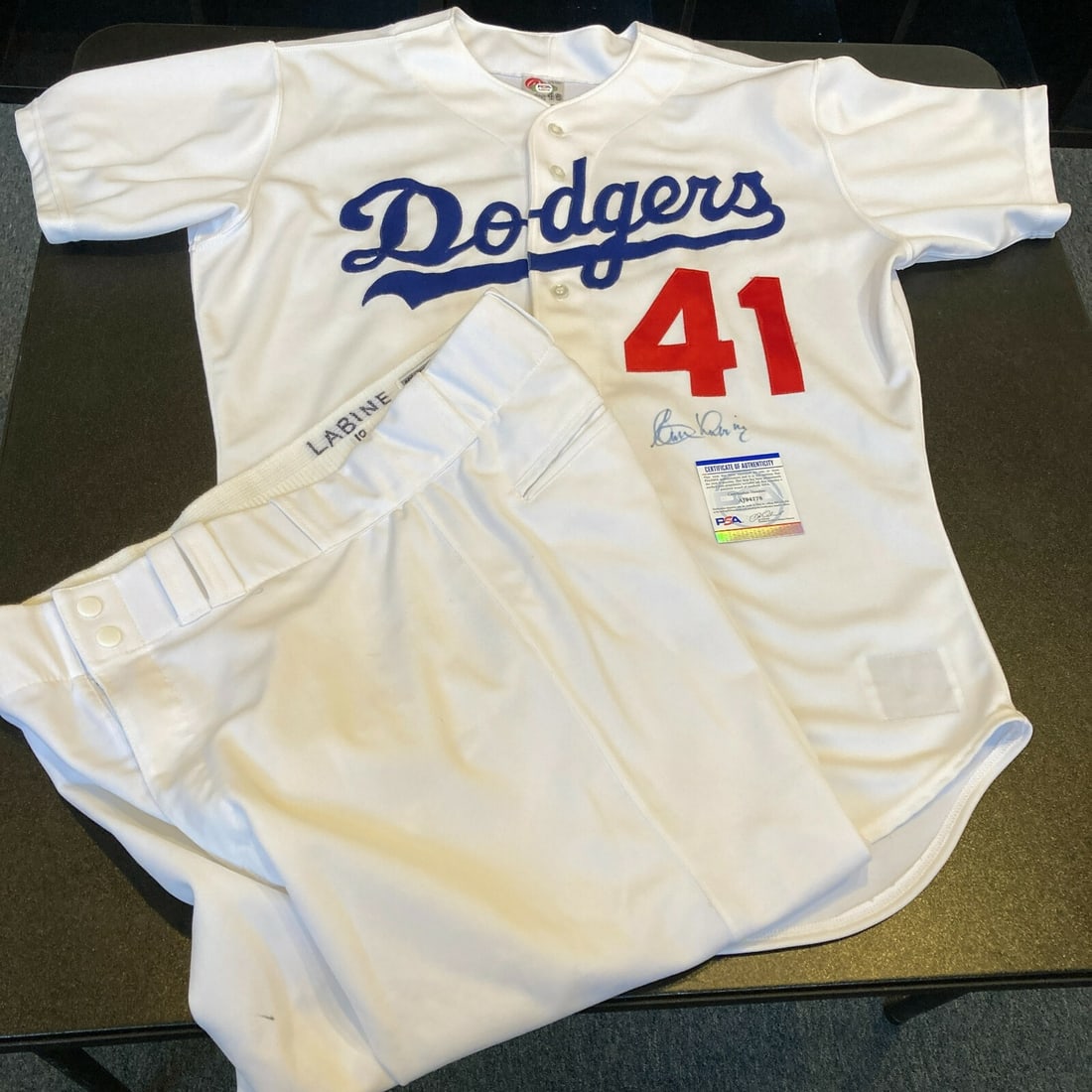 Clem Labine Signed 1990s Dodgers Game Used Jersey & Pants PSA DNA: Clem Labine Signed 1990s Dodgers Game Used Jersey & Pants PSA DNA This is a game-used uniform set from the legendary Clem Labine, featuring a signed jersey and pants from the Los Angeles Dodgers' Old 