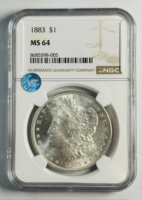 NGC MS64 1883 Philadelphia Morgan Silver Dollar Uncirculated: NGC MS64 1883 Philadelphia Morgan Silver Dollar Uncirculated This is an 1883 Morgan Silver Dollar minted in Philadelphia. The coin is graded MS 64 by NGC and remains uncirculated. It is composed of si