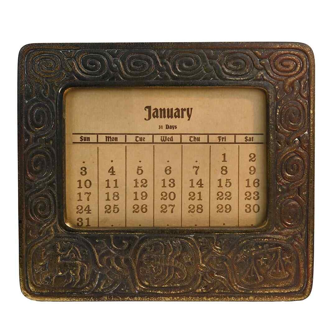 Tiffany Studios Zodiac Perpetual Calendar Frame Antique 1900-1920: Tiffany Studios Zodiac Perpetual Calendar Frame Antique 1900-1920 Discover the exquisite craftsmanship of the Tiffany Studios New York Zodiac Perpetual Calendar Frame, crafted between 1900-1920. This 