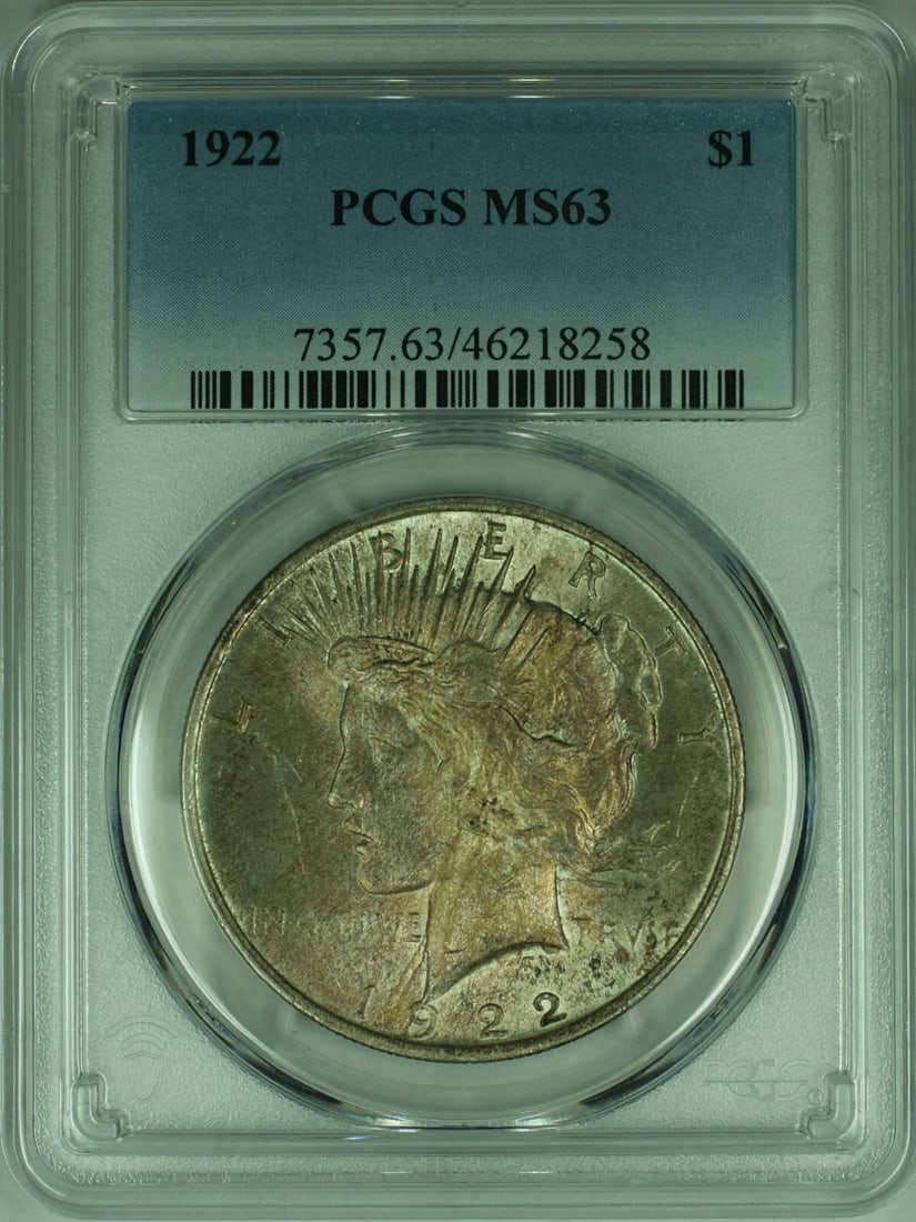 PCGS MS63 1922 Peace Dollar Silver Coin With Toning: PCGS MS63 1922 Peace Dollar Silver Coin With Toning This is a 1922 Peace Silver Dollar with vibrant toning, certified by PCGS and graded MS-63. The coin is uncirculated and features a silver compositi