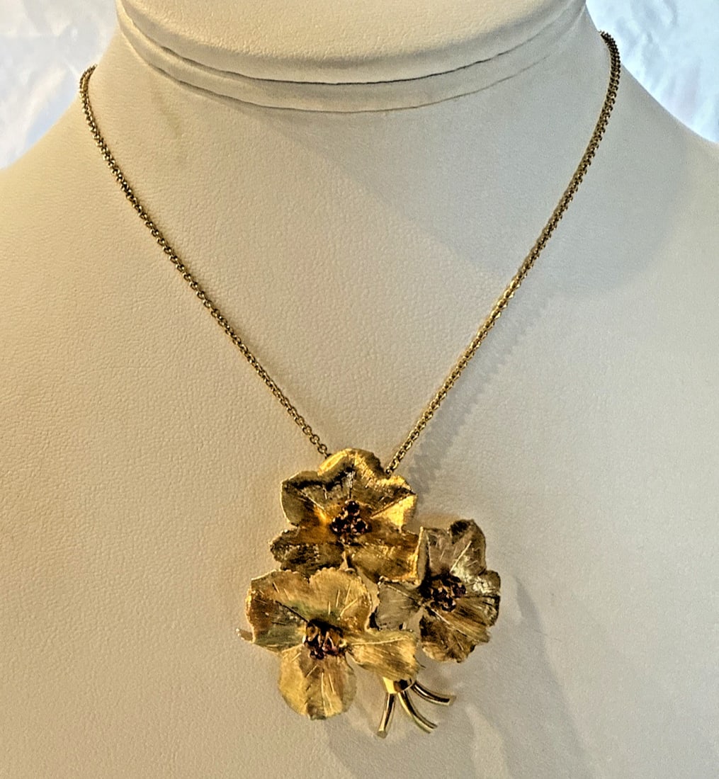 Tiffany & Co 18K Yellow Gold Ruby Floral Brooch Necklace with Boxes: Tiffany & Co 18K Yellow Gold Ruby Floral Brooch Necklace with Boxes Presenting a stunning Tiffany & Co. floral necklace brooch crafted in 18k yellow gold, featuring exquisite ruby accents. This remark