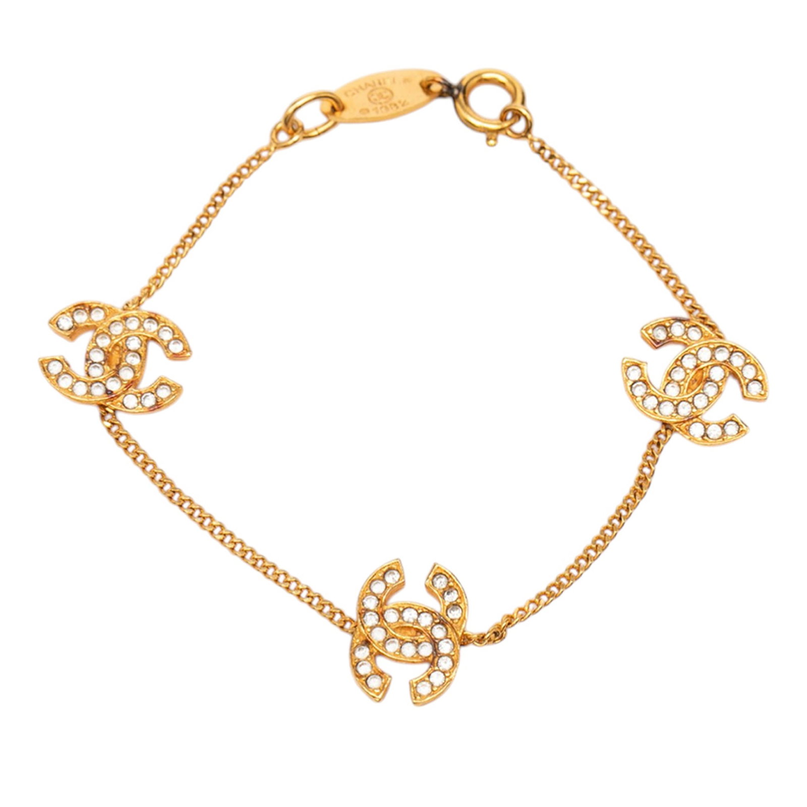 Chanel CC Charm Bracelet with Gold Plating and Rhinestone Accents: Chanel CC Charm Bracelet with Gold Plating and Rhinestone Accents This Chanel bracelet features a gold plated metal chain adorned with CC charms embellished with rhinestones. It is secured with a spri