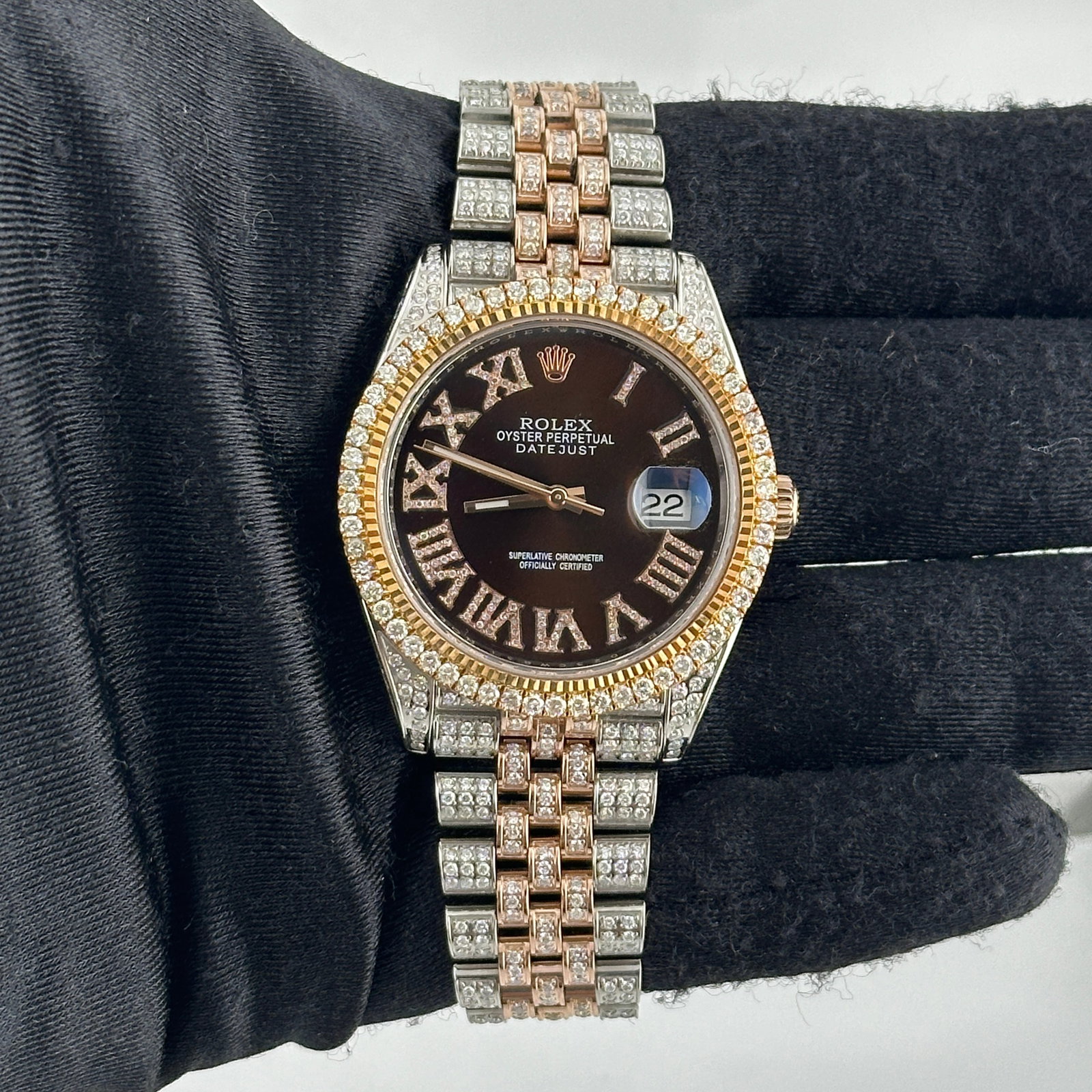 Aftermarket Brown Roman Diamond Dial Datejust Ref 126331 Prong Diamond Bezel Jubilee: Aftermarket Brown Roman Diamond Dial Datejust Ref 126331 Prong Diamond Bezel Jubilee This Rolex Datejust features an Aftermarket brown Roman dial and a prong-plated diamond bezel, paired with an iced 
