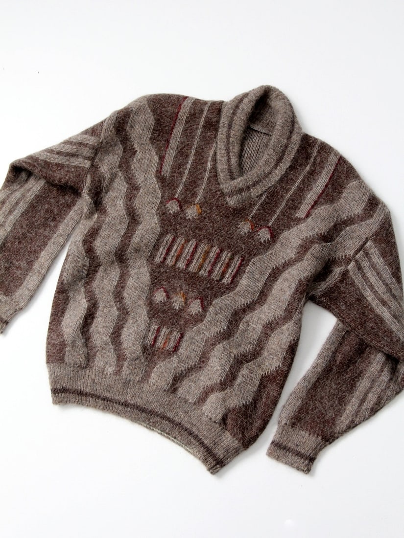 1970s Vintage Mohair Sweater with Shawl Collar and Geometric Pattern: 1970s Vintage Mohair Sweater with Shawl Collar and Geometric Pattern This 1970s vintage men's mohair sweater showcases a stylish shawl collar and a thick knit design. The geometric pattern features na