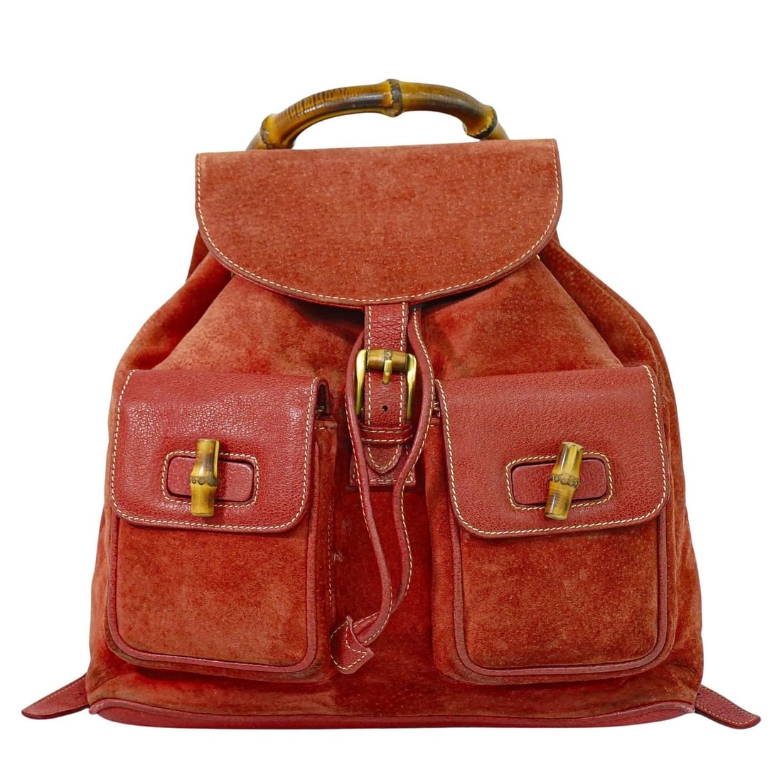 Gucci Suede Pink Vintage Bamboo Backpack for Women: Gucci Suede Pink Vintage Bamboo Backpack for Women This vintage Gucci Bamboo backpack is designed for women and crafted from pink suede. The backpack features the signature bamboo handle design and sh