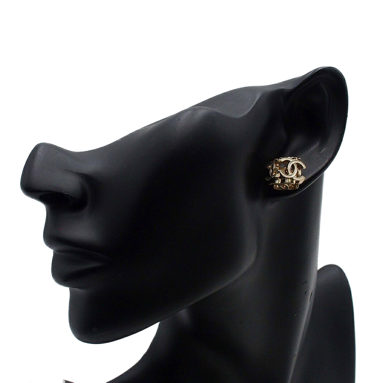 Chanel Enamel Gold Plated Triple CC Push Back Metal Earrings: Chanel Enamel Gold Plated Triple CC Push Back Metal Earrings These Chanel Triple CC earrings feature a gold plated metal body with enamel accents and secure push back closures. Designed as costume jew