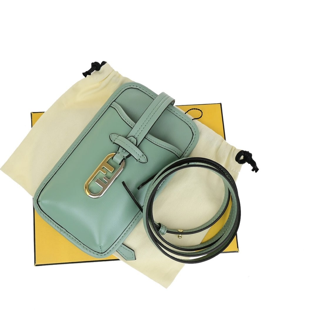 Fendi Green Leather Case for Smartphone 19cm by 11cm by 1.6cm: Fendi Green Leather Case for Smartphone 19cm by 11cm by 1.6cm This Fendi smartphone case for women is crafted from green leather and features a compact design suitable for daily use. It shows signs of
