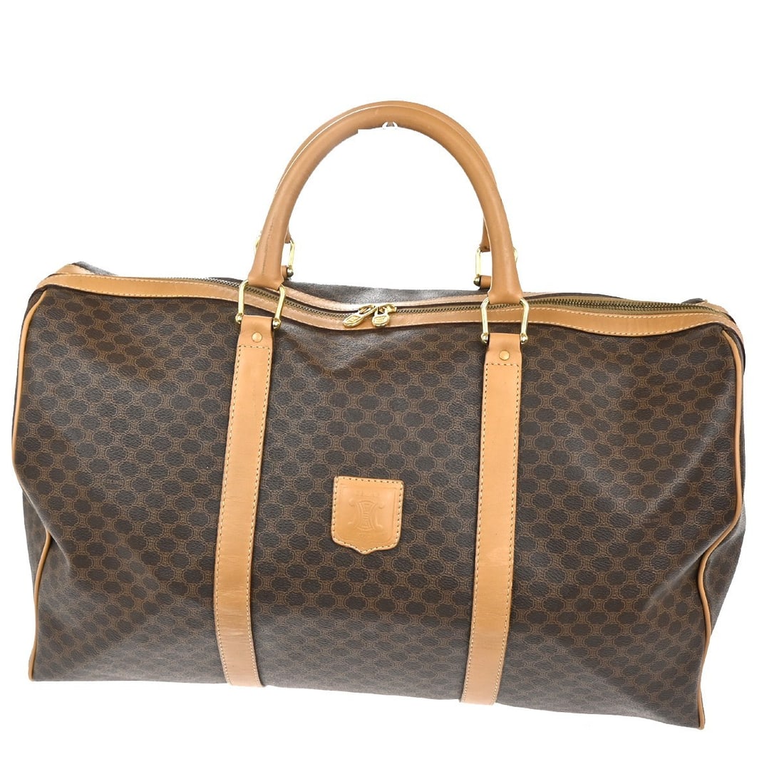 Brown Macadam Vintage Celine Duffle Bag in Coated PVC Canvas: Brown Macadam Vintage Celine Duffle Bag in Coated PVC Canvas This Celine vintage duffle bag features the iconic Macadam coated canvas in brown. Designed for unisex use, it is crafted from durable PVC 