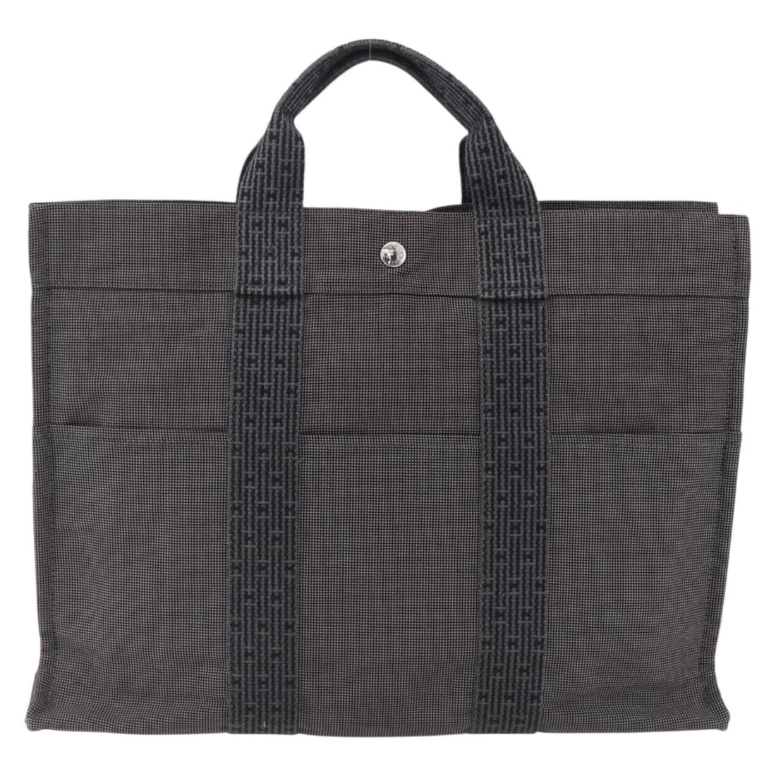Hermes Fourre-tout Herline gray canvas tote bag 42cm: Hermes Fourre-tout Herline gray canvas tote bag 42cm This Hermes Fourre-tout Herline tote bag is crafted from gray canvas and designed for women. It features a spacious interior with multiple pockets 