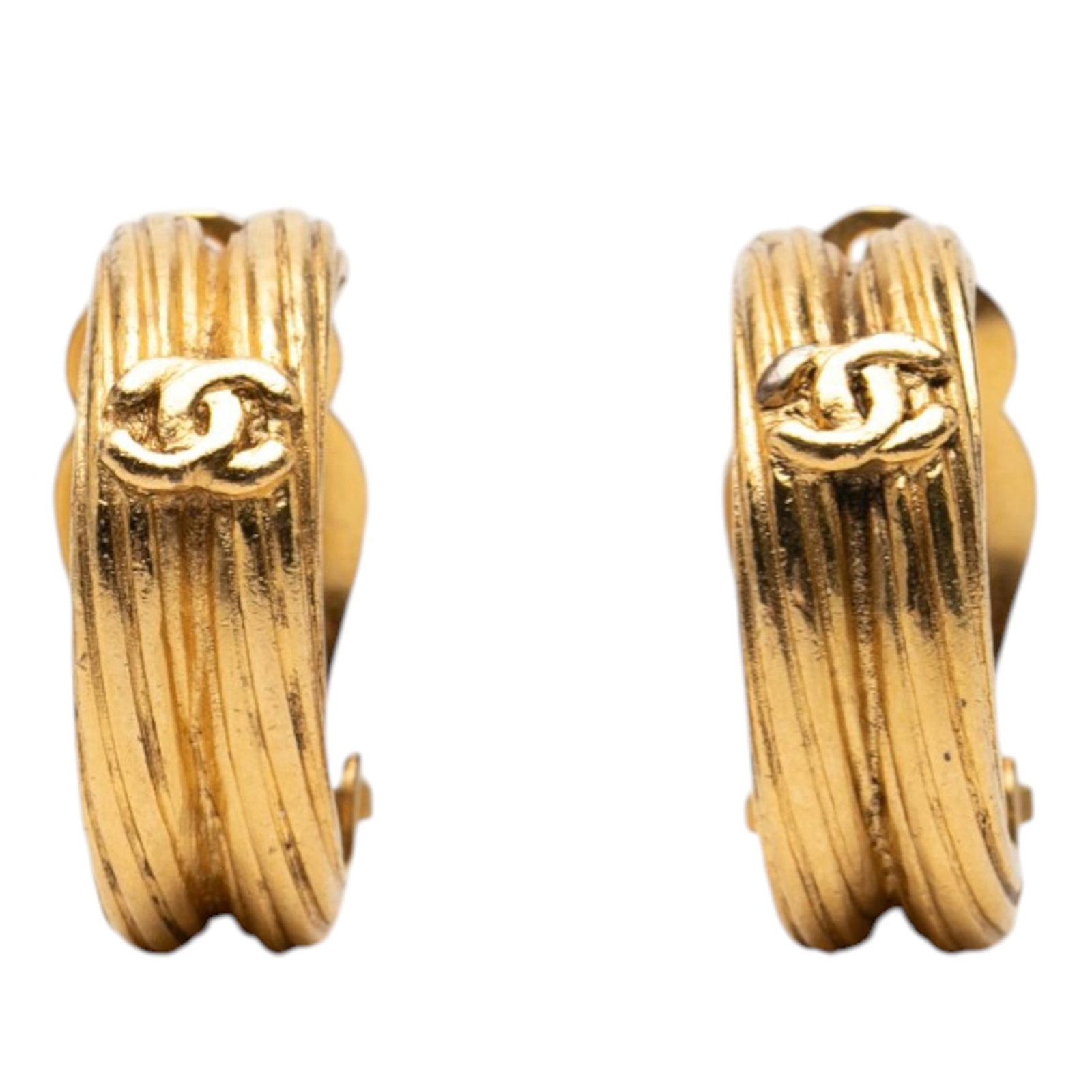 Chanel Interlocking CC Gold Tone Metal Clip Earrings: Chanel Interlocking CC Gold Tone Metal Clip Earrings These Chanel earrings feature gold plated metal bodies with the signature interlocking CC logo and a convenient clip-on closure. Classified as cost