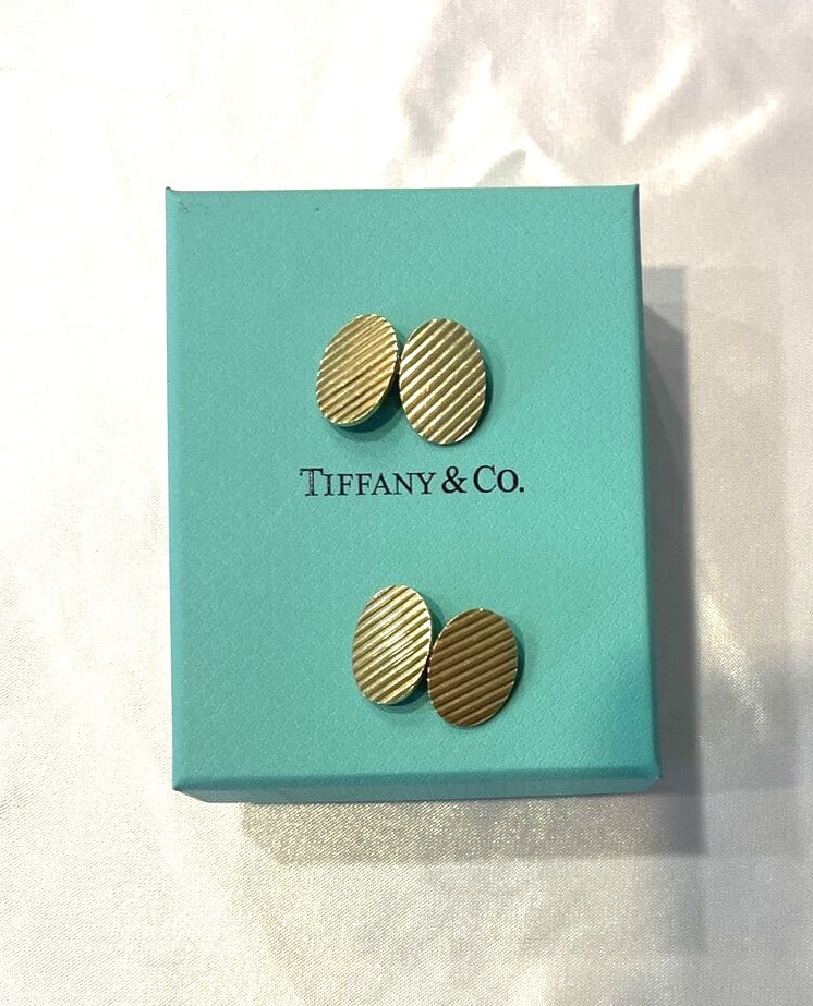 Tiffany & Co 14K Yellow Gold Cufflinks Circa 1940s with Box: Tiffany & Co 14K Yellow Gold Cufflinks Circa 1940s with Box Discover a stunning pair of Tiffany & Co. cufflinks crafted from 14k yellow gold, dating back to the 1940s. These exquisite cufflinks showca