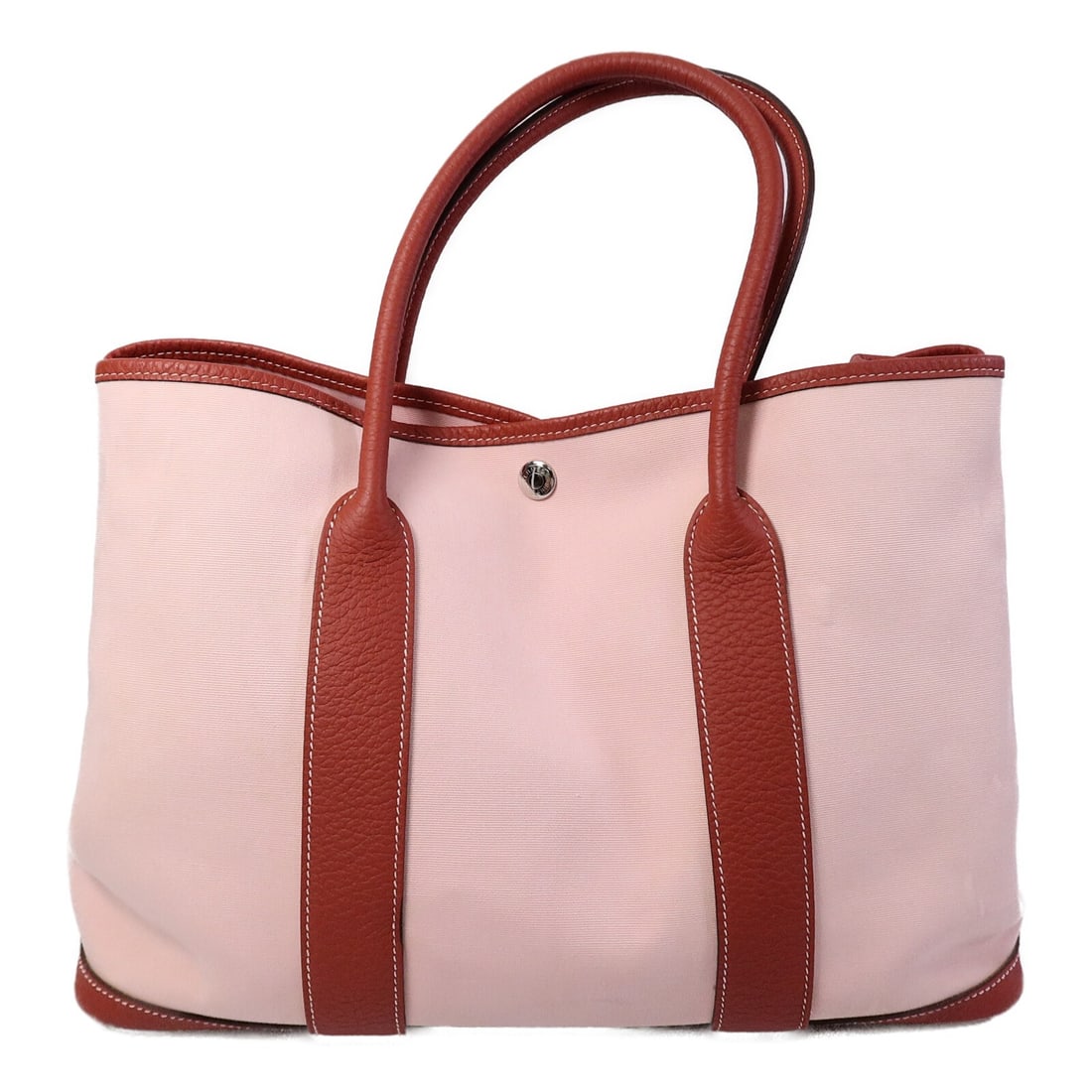 Hermes Garden Party PM Pink Canvas Shoulder Handbag: Hermes Garden Party PM Pink Canvas Shoulder Handbag This Hermes Garden Party PM shoulder bag features a pink canvas exterior in the Rose Sakura/Rouge colorway. Designed for women, the bag offers a ble