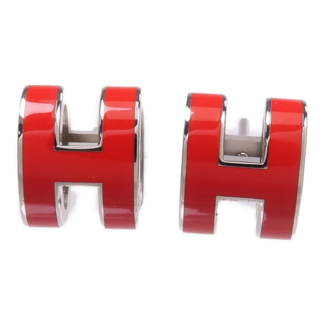Red and Silver Pop H Pierced Earrings by Hermes: Red and Silver Pop H Pierced Earrings by Hermes These Hermes Pop H pierced earrings feature a stylish red and silver design. Crafted from metal, they offer a modern look without a main stone. Made in 