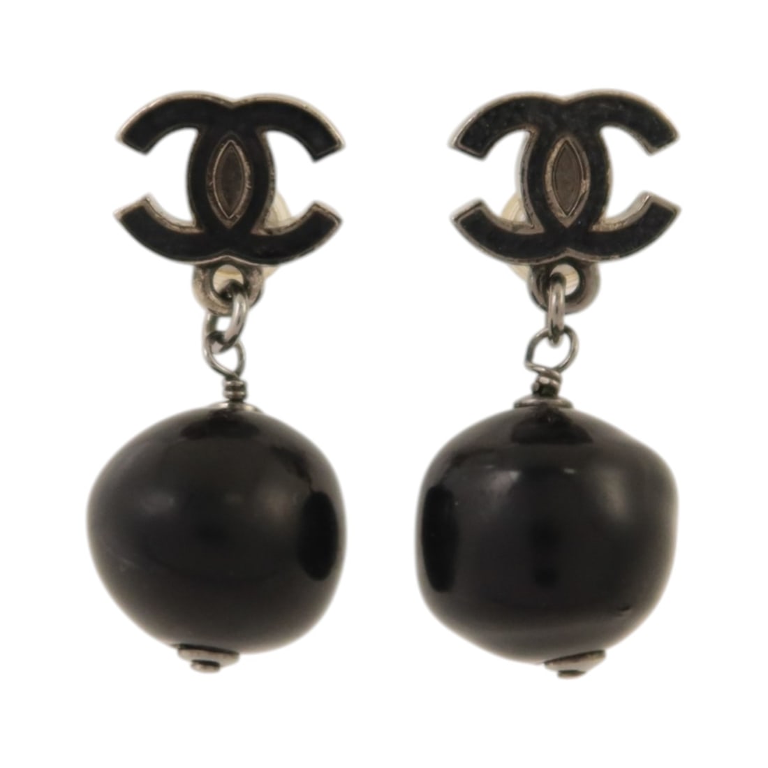 Silver and Black CC Logo Pierced Earrings by Chanel 10C: Silver and Black CC Logo Pierced Earrings by Chanel 10C These CHANEL CC earrings feature a stylish combination of silver and black tones. Crafted from PVC and metal, they are designed as pierced earri