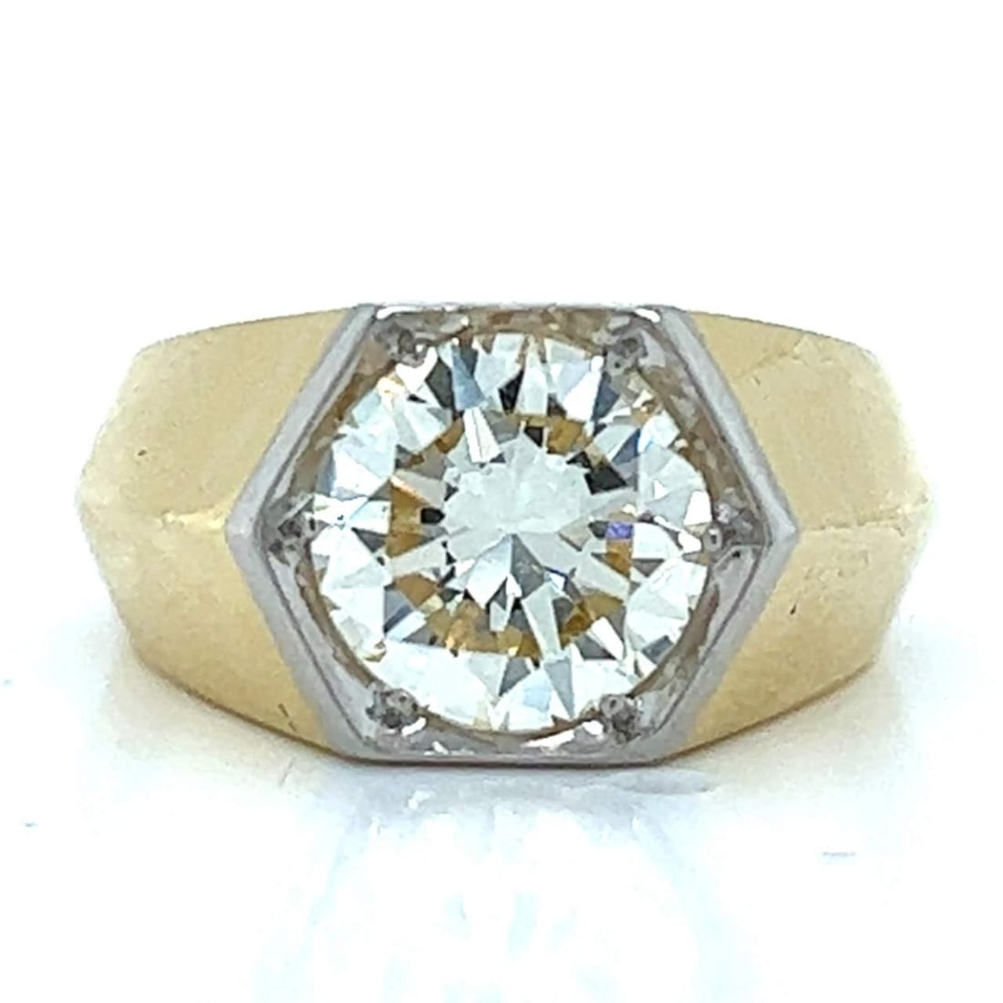 1960's 18K Yellow Gold Platinum 2.60 Ct Diamond Ring VVS O-P Color: 1960's 18K Yellow Gold Platinum 2.60 Ct Diamond Ring VVS O-P Color This exquisite 1960's ring showcases a stunning 2.60 Ct. diamond at its center, characterized by an O-P color and VVS clarity, ensuri