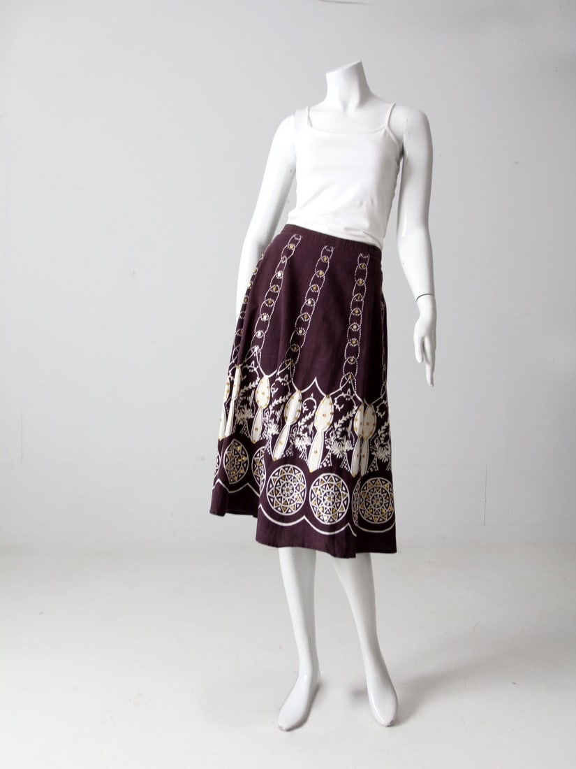 Vintage Boho Midi Skirt with Gold Sequins Geometric Print: Vintage Boho Midi Skirt with Gold Sequins Geometric Print Elevate your wardrobe with this Vintage Boho Print Skirt, a stunning piece featuring a classic full midi design adorned with a graphic geometr