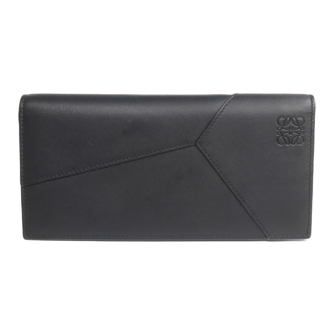 LOEWE Puzzle Calfskin Black Bifold Wallet: LOEWE Puzzle Calfskin Black Bifold Wallet This LOEWE Puzzle Long Horizontal Wallet is crafted from high-quality calfskin leather in a classic black color. Designed in a bifold style, it offers both el