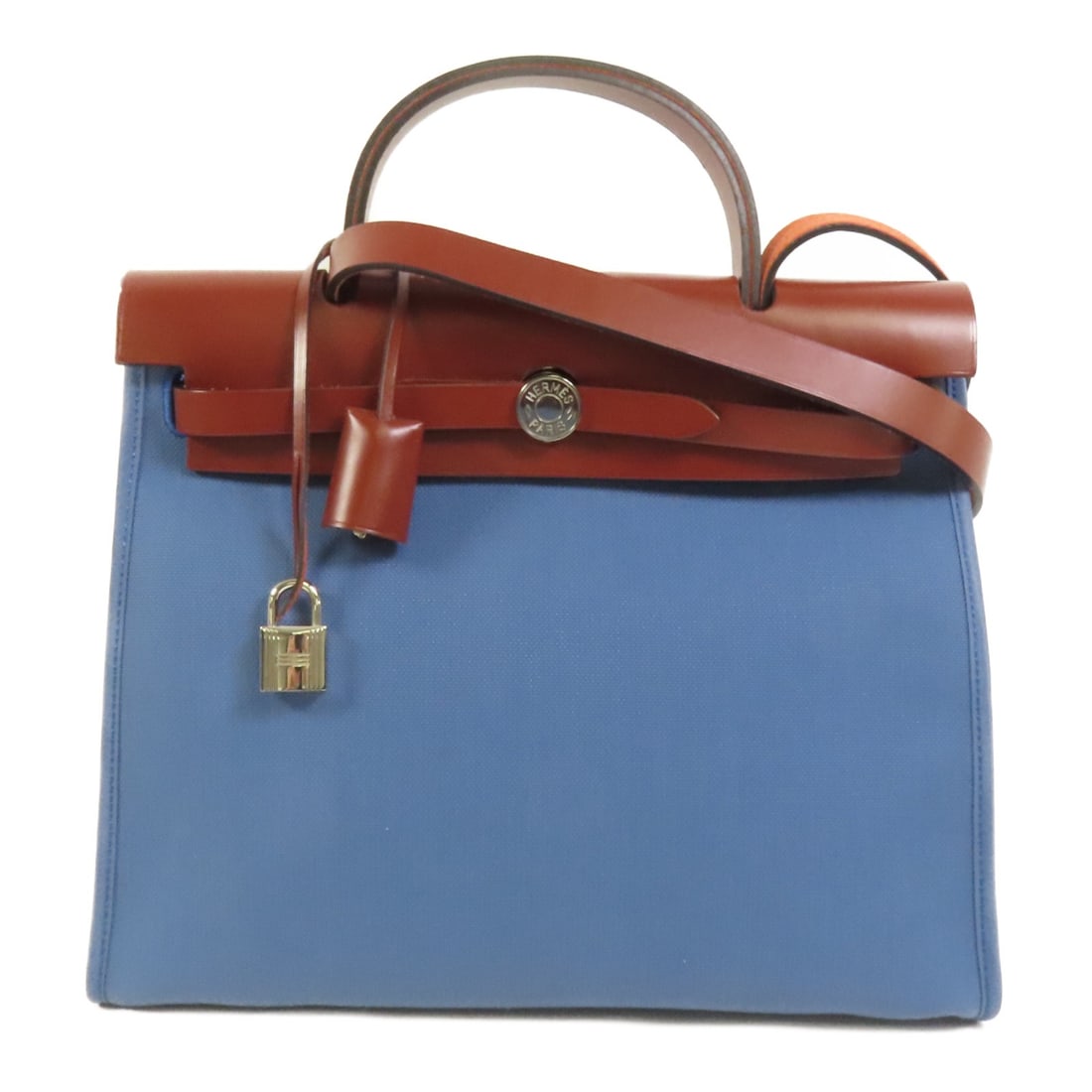 Herbag PM Blue Canvas Shoulder Bag with Palladium Hardware by Hermes: Herbag PM Blue Canvas Shoulder Bag with Palladium Hardware by Hermes This Hermes Herbag PM is a versatile 2-way shoulder handbag crafted from durable blue canvas. Designed for women, it features a sty