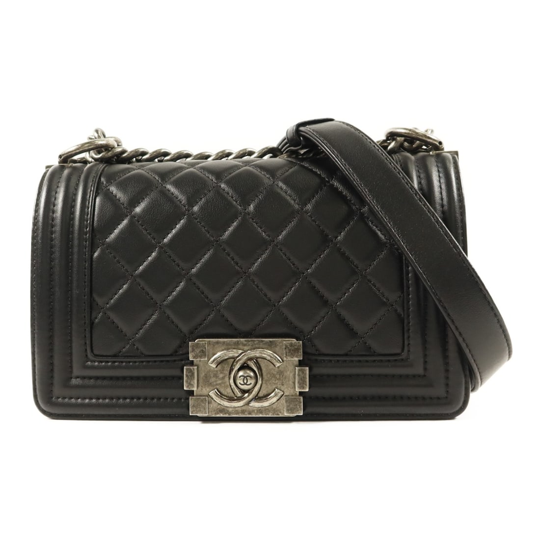 Black Lambskin CHANEL Boy 20 Shoulder Bag with Chain Strap: Black Lambskin CHANEL Boy 20 Shoulder Bag with Chain Strap This CHANEL CC Boy 20 chain shoulder bag is crafted from luxurious black lambskin leather. Designed for women, it features a classic shoulder
