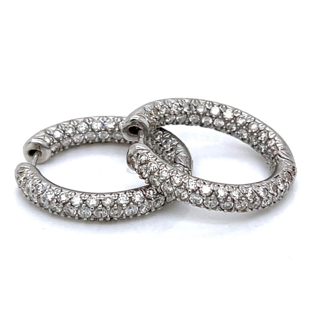 18K White Gold 4.25 Ct Diamond Hoop Earrings: 18K White Gold 4.25 Ct Diamond Hoop Earrings These stunning 18K white gold inside-outside hoop earrings feature a dazzling total of approximately 4.25 carats of diamonds. The diamonds are graded F-G i