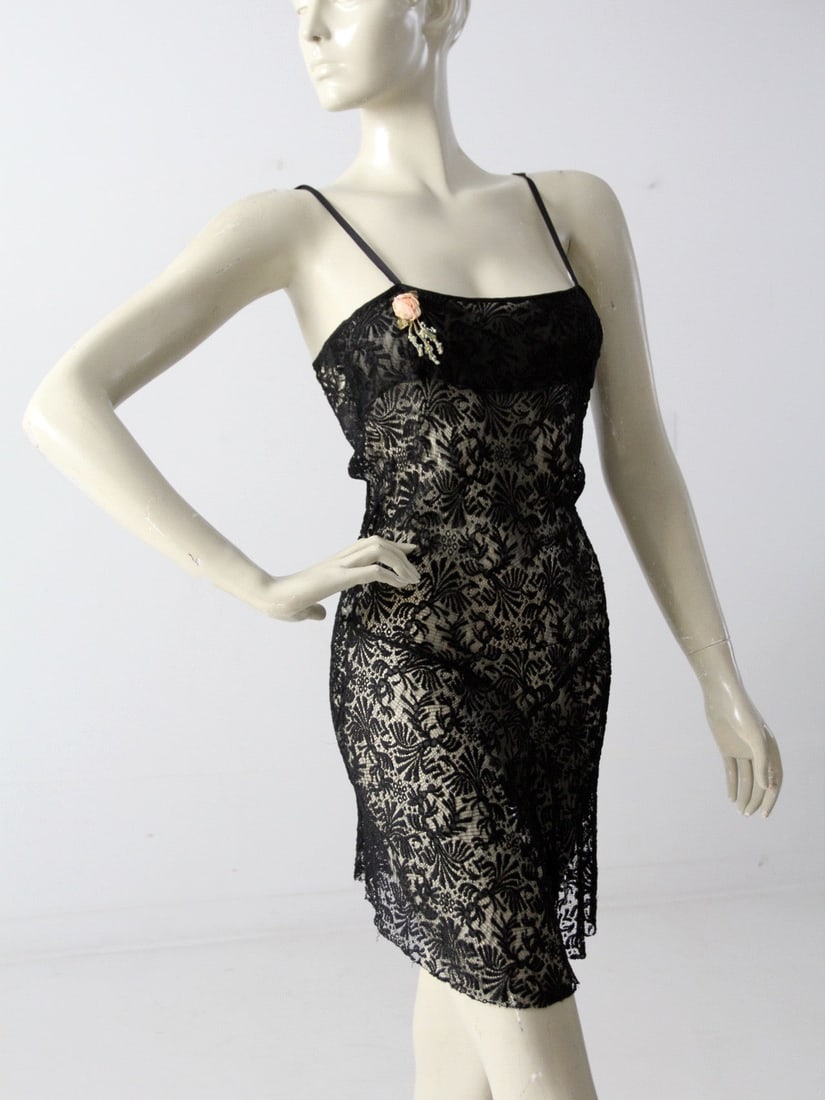 1930s Vintage Black Lace Romper Negligee with Rose Applique: 1930s Vintage Black Lace Romper Negligee with Rose Applique Step back in time with this 1930s vintage black lace negligee, a perfect blend of drama and sweetness. This stunning piece features a netted