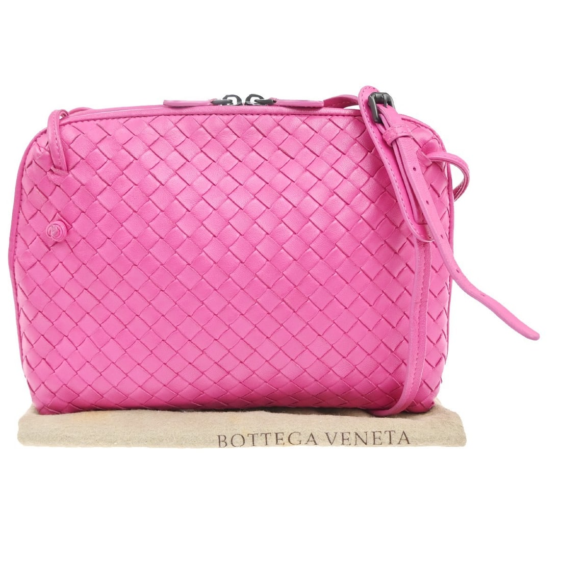Pink Leather Nodini Crossbody Bag by Bottega Veneta: Pink Leather Nodini Crossbody Bag by Bottega Veneta This Bottega Veneta Nodini Crossbody Bag is crafted from pink leather featuring the brand's signature Intrecciato nappa weave. Designed for women, i