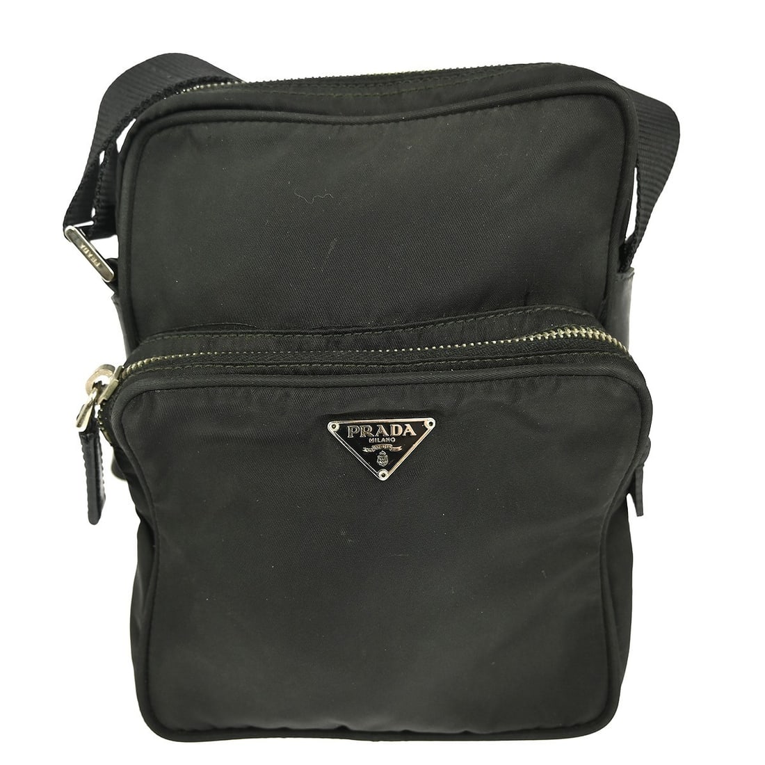 Prada Medium Black Nylon Shoulder Bag with Logo Accent: Prada Medium Black Nylon Shoulder Bag with Logo Accent This stylish Prada shoulder bag is crafted from durable black nylon, making it perfect for casual occasions. With a medium size, it features a sl