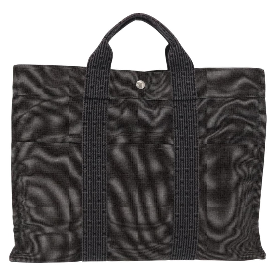 Hermes Herline Gray Canvas Tote Bag 43cm by 30cm by 10cm: Hermes Herline Gray Canvas Tote Bag 43cm by 30cm by 10cm This Hermes Fourre-tout Herline canvas tote bag features a gray canvas construction designed for female use. It shows signs of wear including s