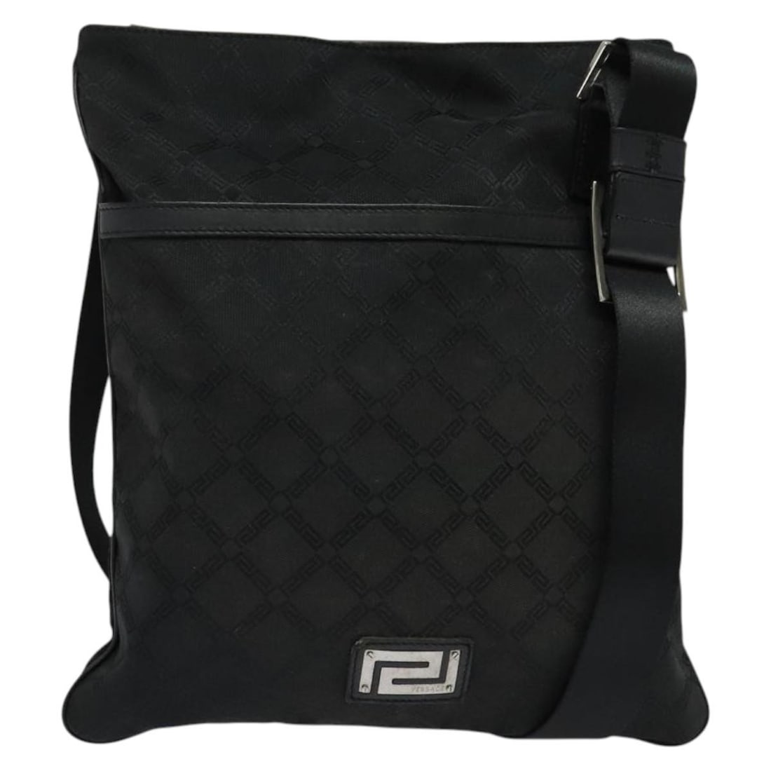 Versace Black Canvas Messenger Bag for Women 30cm x 34cm: Versace Black Canvas Messenger Bag for Women 30cm x 34cm This Versace messenger bag is crafted from black canvas and designed for women. Made in Italy, it features a spacious interior and a slim profi