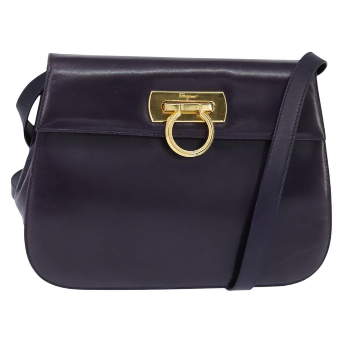 Gancini Navy Leather Shoulder Bag by Salvatore Ferragamo: Gancini Navy Leather Shoulder Bag by Salvatore Ferragamo This Salvatore Ferragamo Gancini shoulder bag features a navy leather exterior and is designed for women. The bag shows signs of use, including