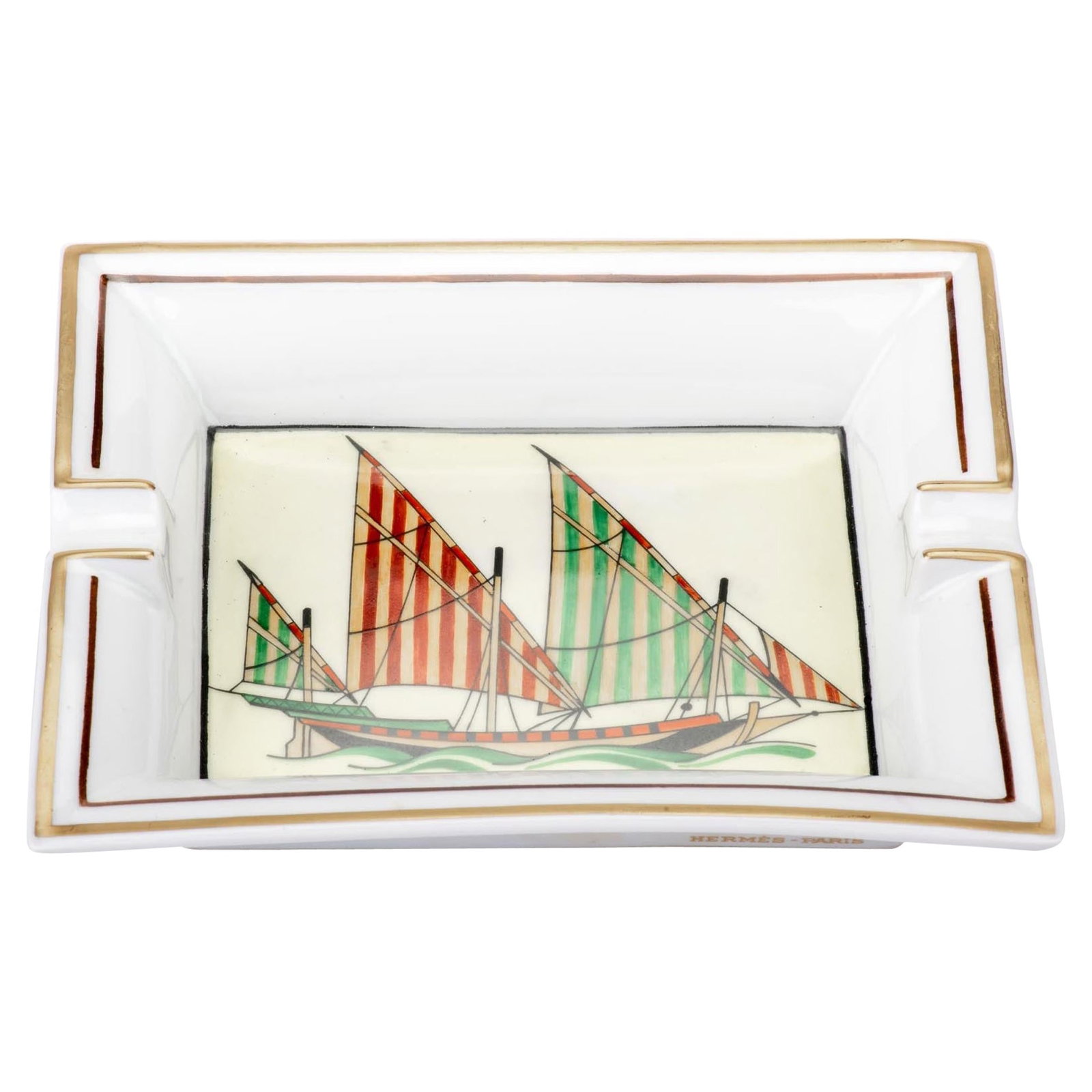 Hermes Limoges Porcelain White Gold Sailing Boat Ashtray: Hermes Limoges Porcelain White Gold Sailing Boat Ashtray This exquisite Hermes ashtray features a stunning sailing boat design crafted from Limoges porcelain. The piece showcases a harmonious blend of