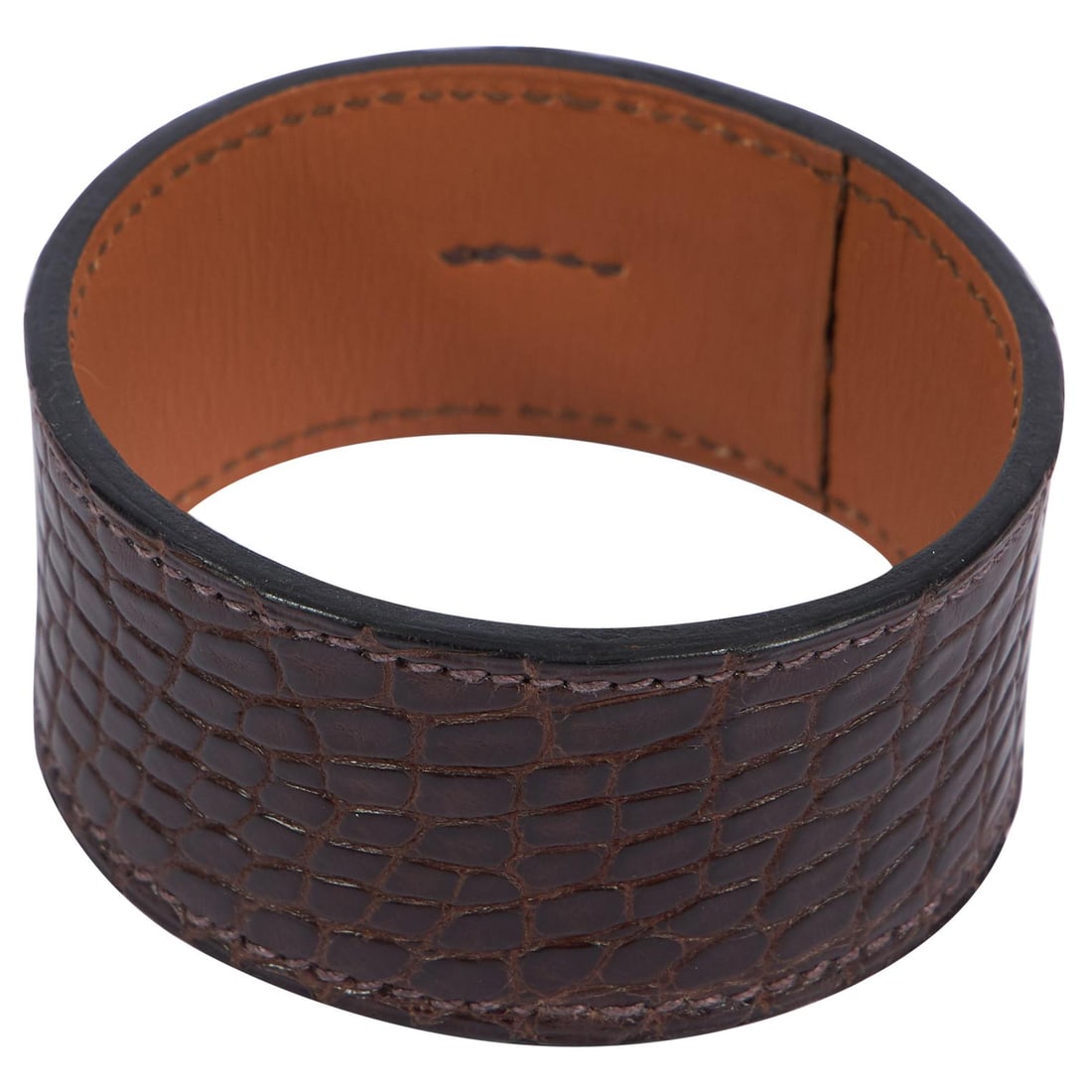 Hermes Brown Porosus Crocodile Cuff Bracelet with Box: Hermes Brown Porosus Crocodile Cuff Bracelet with Box This exquisite Hermes cuff is crafted from luxurious brown porosus crocodile leather, showcasing the brand's commitment to quality and elegance. M