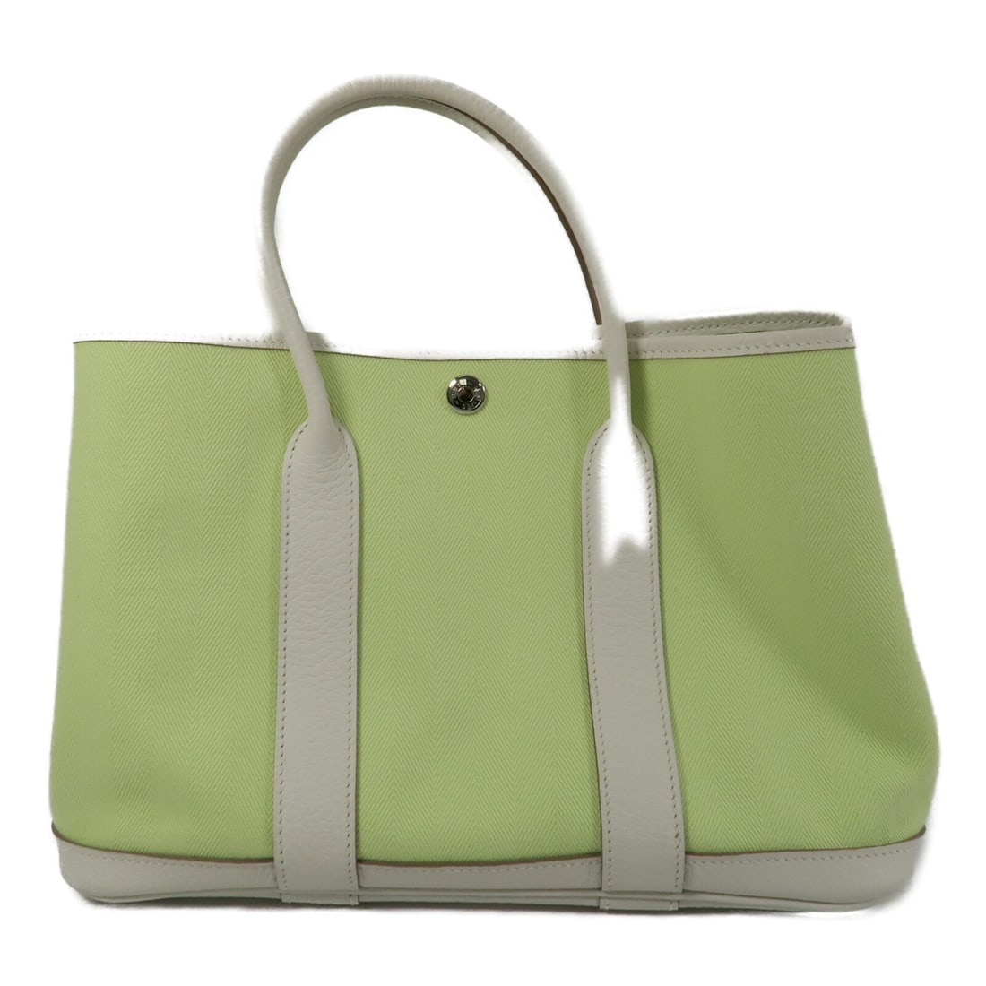 Hermes Garden Party TPM Canvas Tote Bag Green: Hermes Garden Party TPM Canvas Tote Bag Green This Hermes Garden Party TPM tote bag is crafted from durable canvas in a vibrant green shade. It features a spacious interior, making it suitable for dai