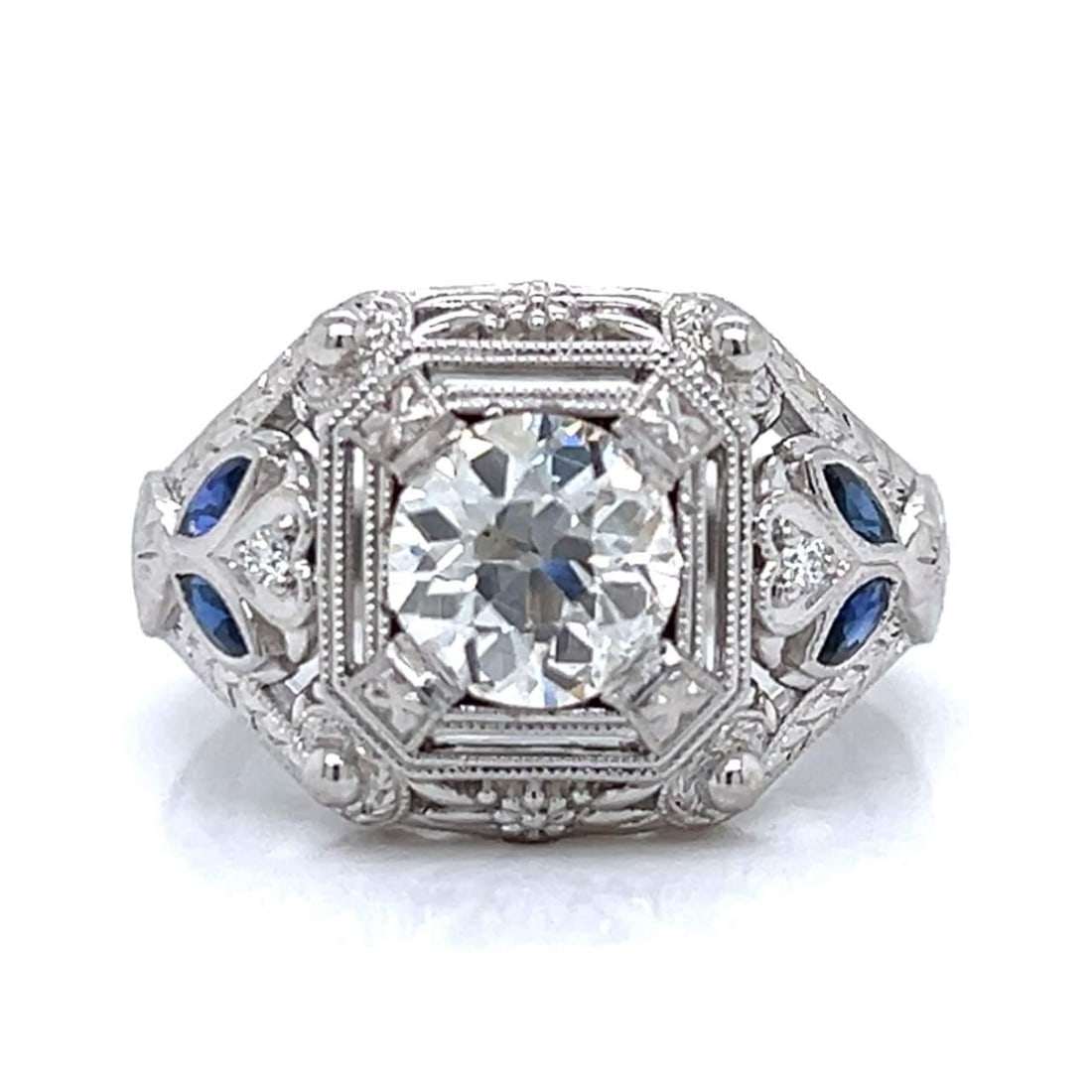 Platinum 1.62 Ct. European-Cut Diamond Sapphire Ring: Platinum 1.62 Ct. European-Cut Diamond Sapphire Ring This exquisite Platinum ring features a stunning 1.62 Ct. European-cut diamond, showcasing I-J color and SI1 clarity. The design is enhanced with t