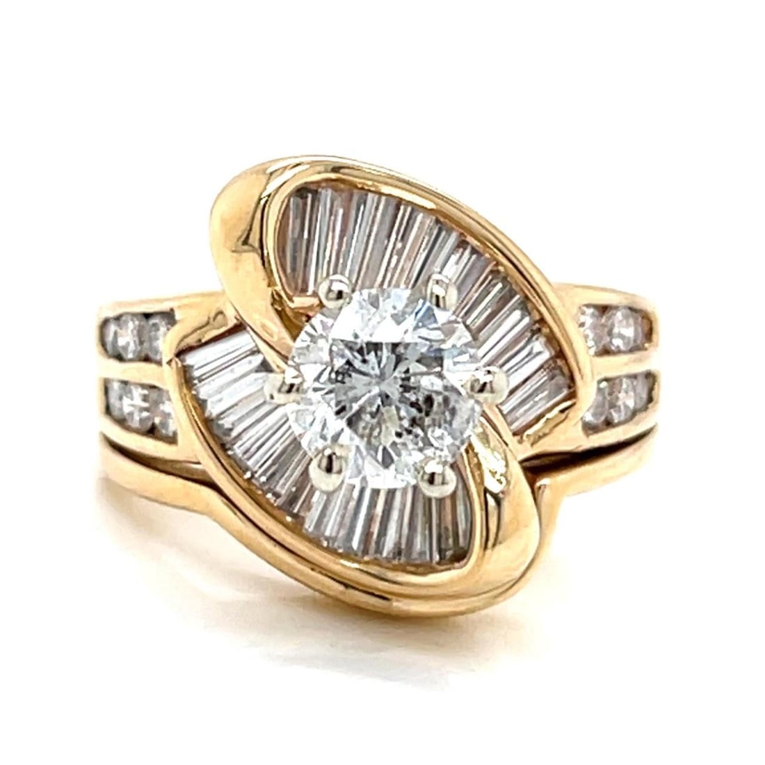Diamond Ring in 14K Yellow Gold with 3.30 Carats Total Weight: Diamond Ring in 14K Yellow Gold with 3.30 Carats Total Weight This pre-owned ring is crafted in 14K yellow gold and features a central diamond of approximately 1.30 carats with F-G color and I1-I2 cla