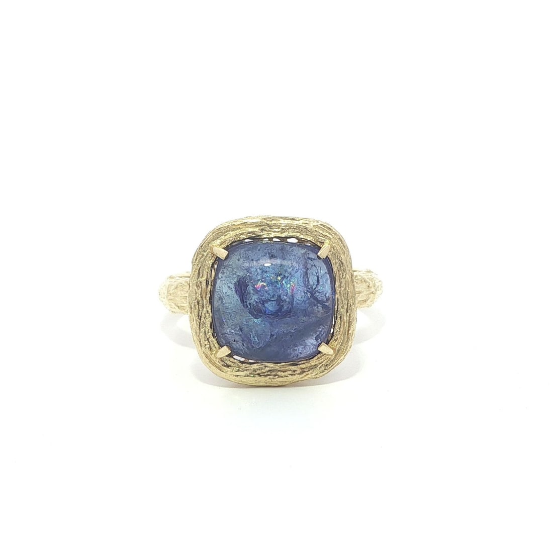 14k Yellow Gold Tanzanite Cabochon Solitaire Ring Bark Textured: 14k Yellow Gold Tanzanite Cabochon Solitaire Ring Bark Textured This women's ring features a natural blue tanzanite in a cushion cabochon cut, prong set as a solitaire. Crafted from solid 14k yellow g