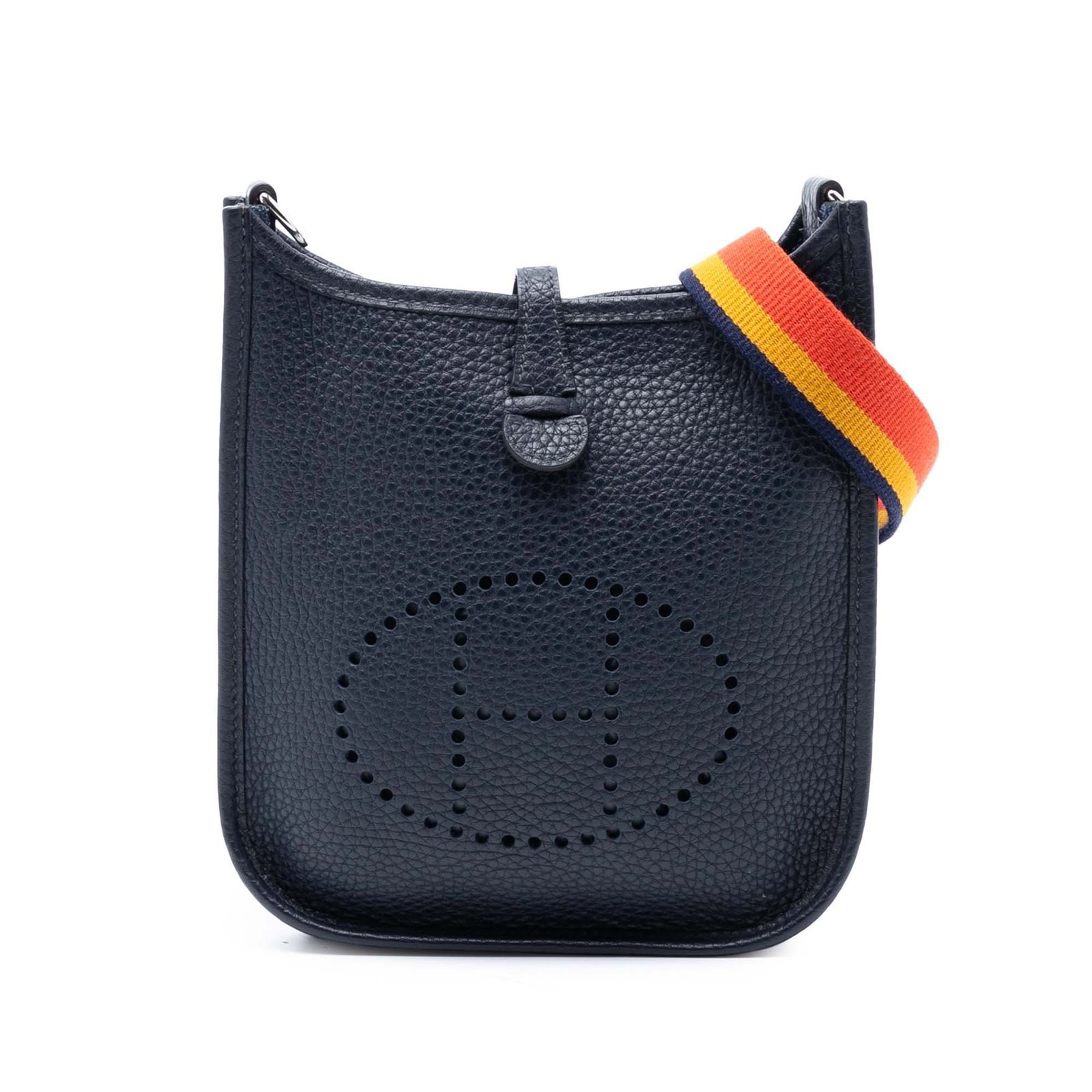 Blue Clemence Leather Evelyne TPM Bag with Canvas Strap by Hermes: Blue Clemence Leather Evelyne TPM Bag with Canvas Strap by Hermes The Evelyne TPM bag showcases Clemence leather in Bleu Nuit, complemented by a flat canvas strap and an open top with a tuck closure. 