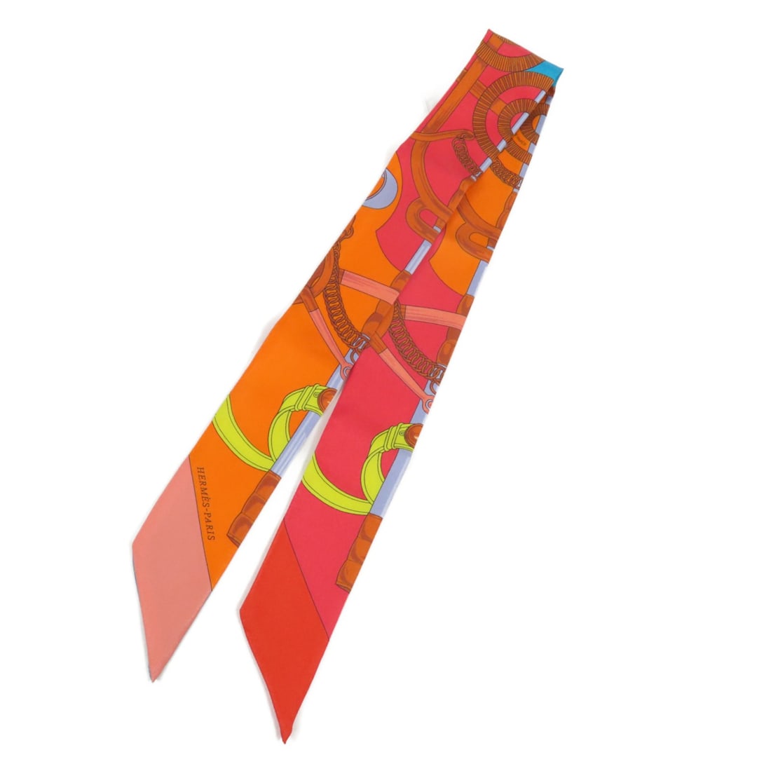 Silk Twilly Scarf by HERMES Multicolor French Accessory: Silk Twilly Scarf by HERMES Multicolor French Accessory This Hermes Twilly scarf is crafted from luxurious silk and features a vibrant multicolor design. Designed for women, it offers a versatile acce