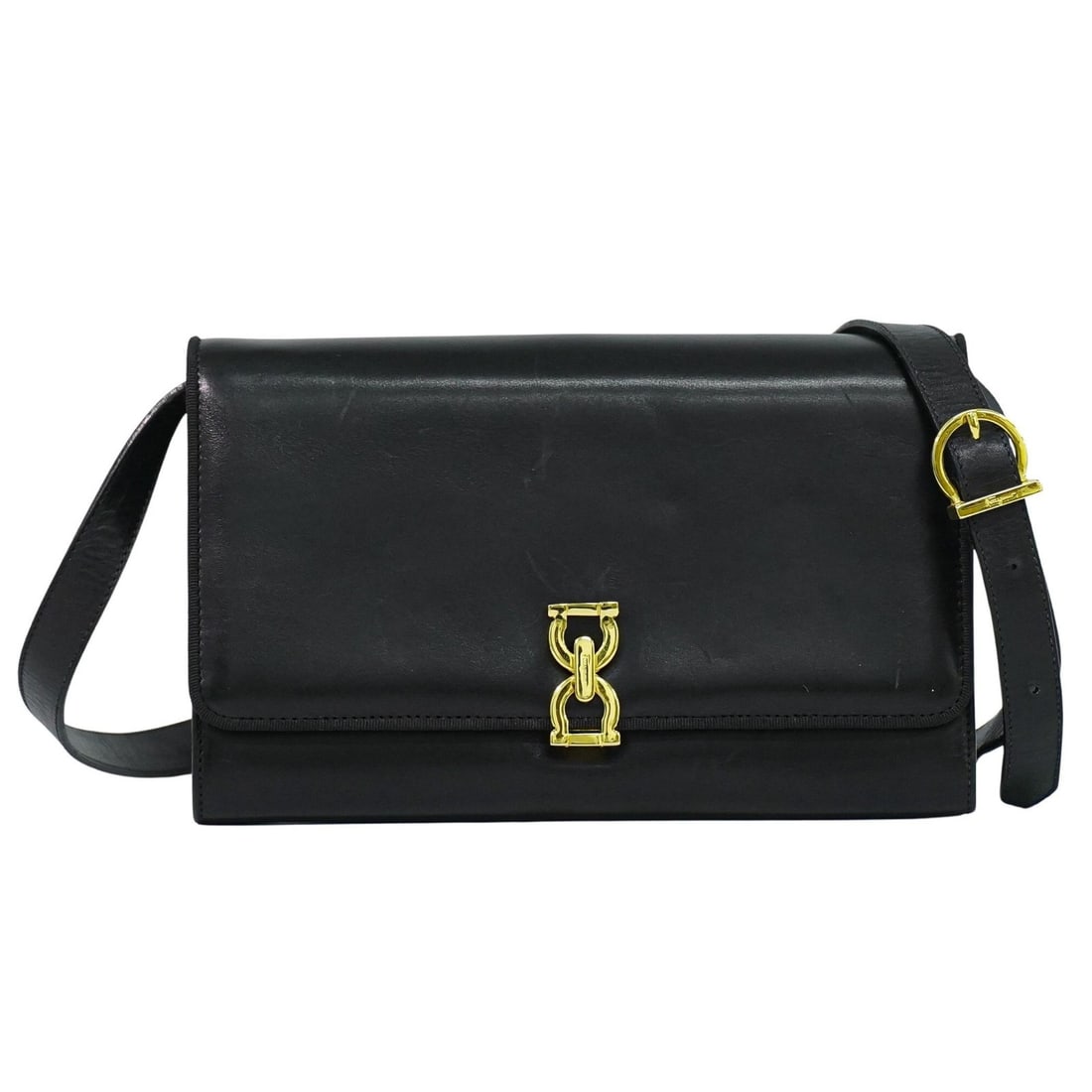 Gancini Black Leather Shoulder Bag by Salvatore Ferragamo: Gancini Black Leather Shoulder Bag by Salvatore Ferragamo This Salvatore Ferragamo Gancini shoulder bag is crafted from black leather and features the iconic Gancini design. Designed for women, it off