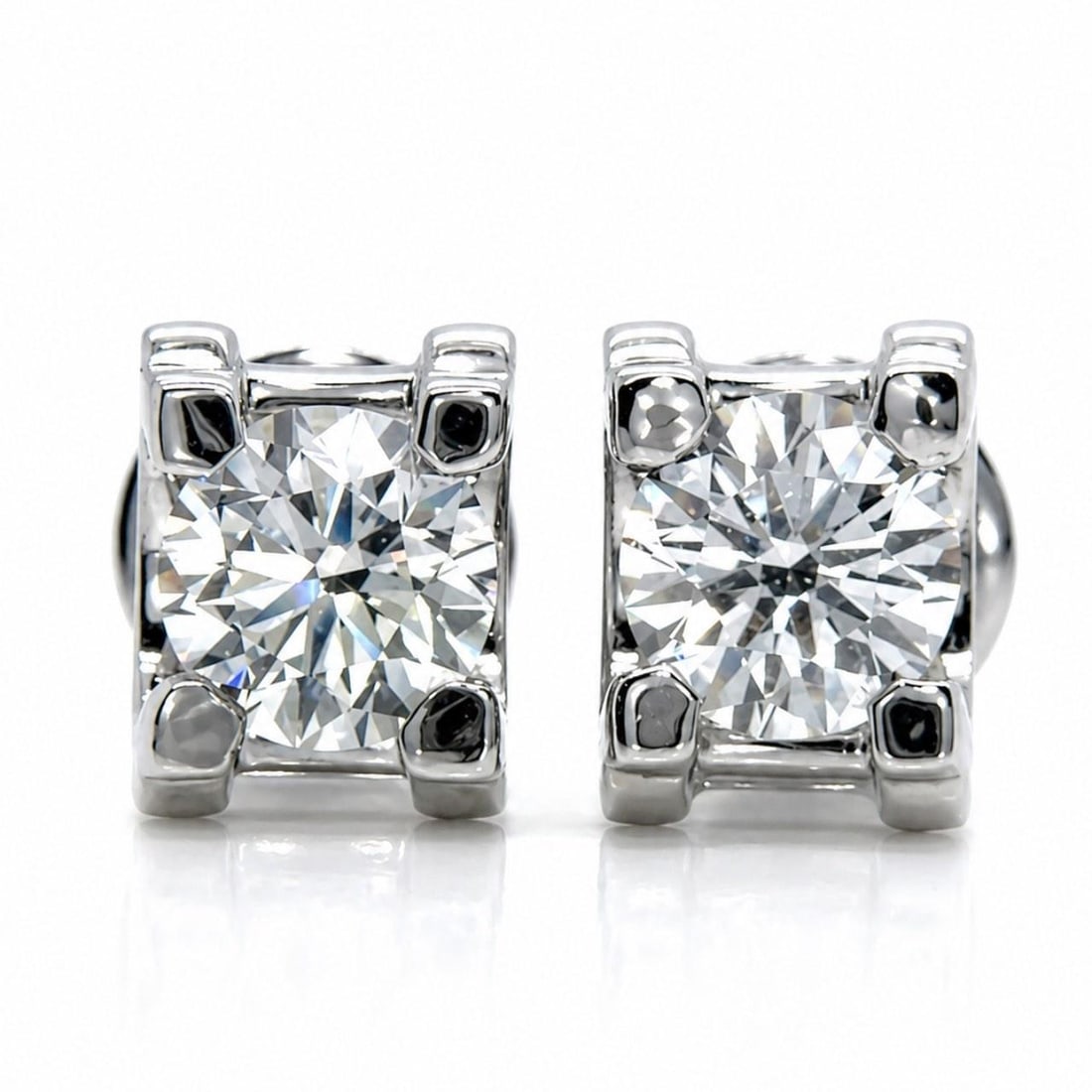 Cartier Diamond Stud Earrings in 18K White Gold with GIA Certification: Cartier Diamond Stud Earrings in 18K White Gold with GIA Certification These Cartier stud earrings are crafted from 18K white gold and feature two GIA certified diamonds with a total weight of 2.01 ct