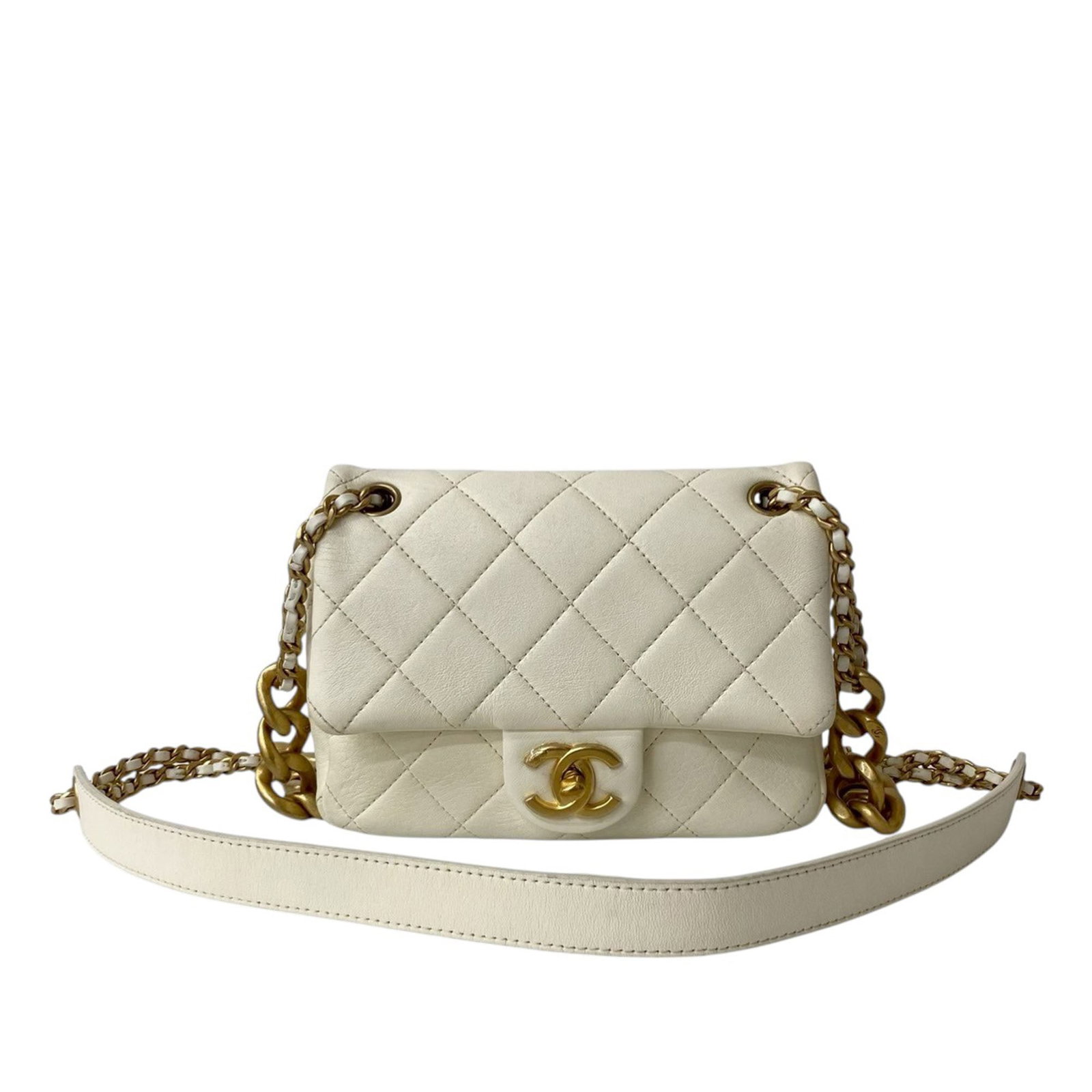 White Chanel Mini Lambskin Crossbody with Dual Chain and CC Turn Lock: White Chanel Mini Lambskin Crossbody with Dual Chain and CC Turn Lock This Chanel Mini Quilted Shiny Lambskin Dual Chain Flap crossbody bag features a quilted lambskin leather body with a glossy finis