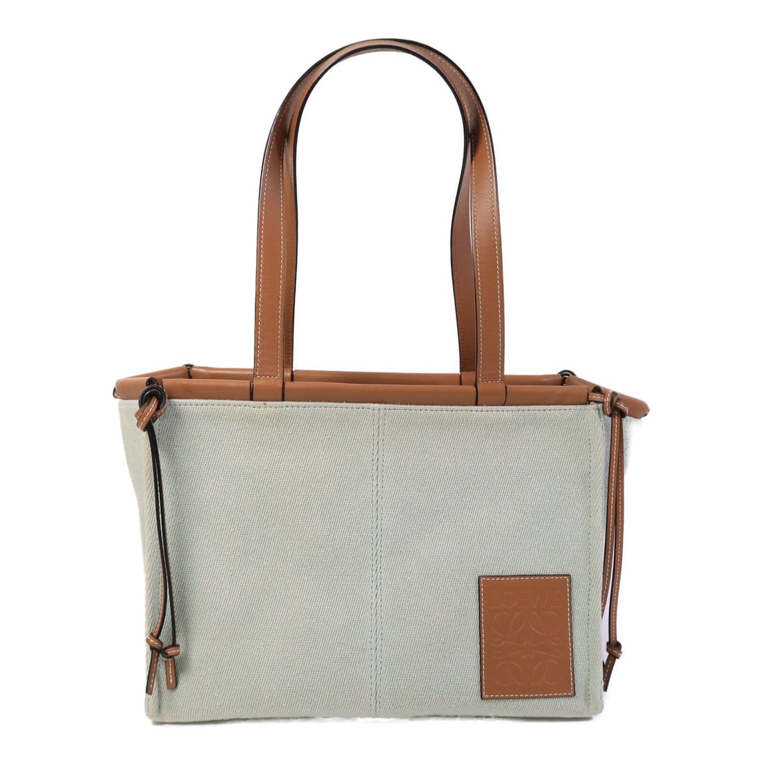 LOEWE Green Canvas Tote Bag Cushion Style: LOEWE Green Canvas Tote Bag Cushion Style This LOEWE Cushion Tote Bag features a green canvas exterior with brown accents, offering a stylish and functional design. Made in Spain, this women's tote is