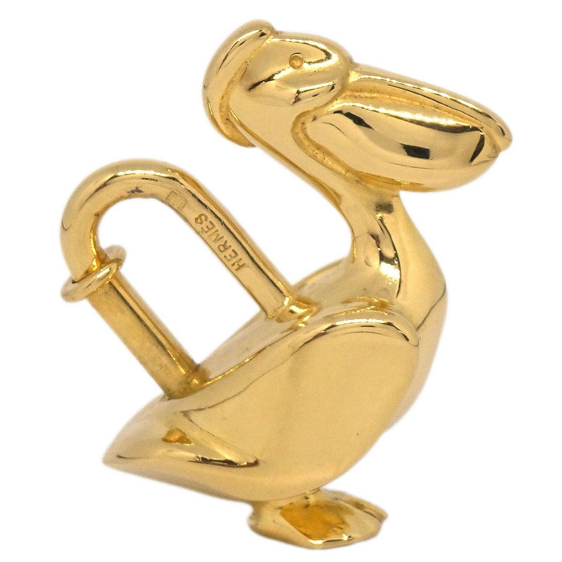 Hermes 1992 Pelican Cadena Gold Tone Limited Edition Bag Charm: Hermes 1992 Pelican Cadena Gold Tone Limited Edition Bag Charm This Hermes charm features a pelican motif and was produced as a limited edition Cadena padlock in 1992. It is crafted in gold-tone metal
