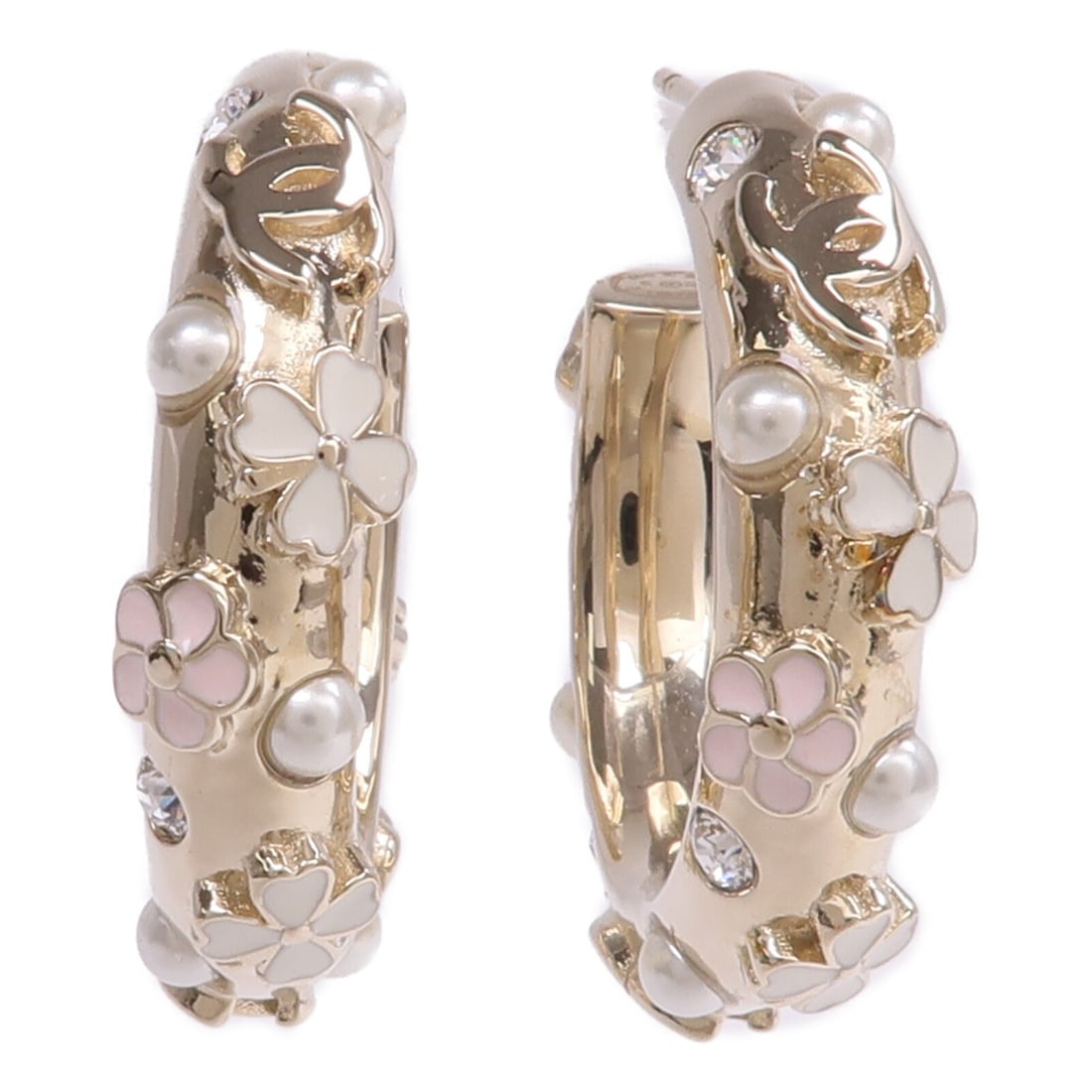 Gold Metal Pierced Earrings with CC Logo by CHANEL: Gold Metal Pierced Earrings with CC Logo by CHANEL These CHANEL CC pierced earrings are crafted in gold-toned metal and feature the iconic CC logo. Designed for women, these earrings have no stones an